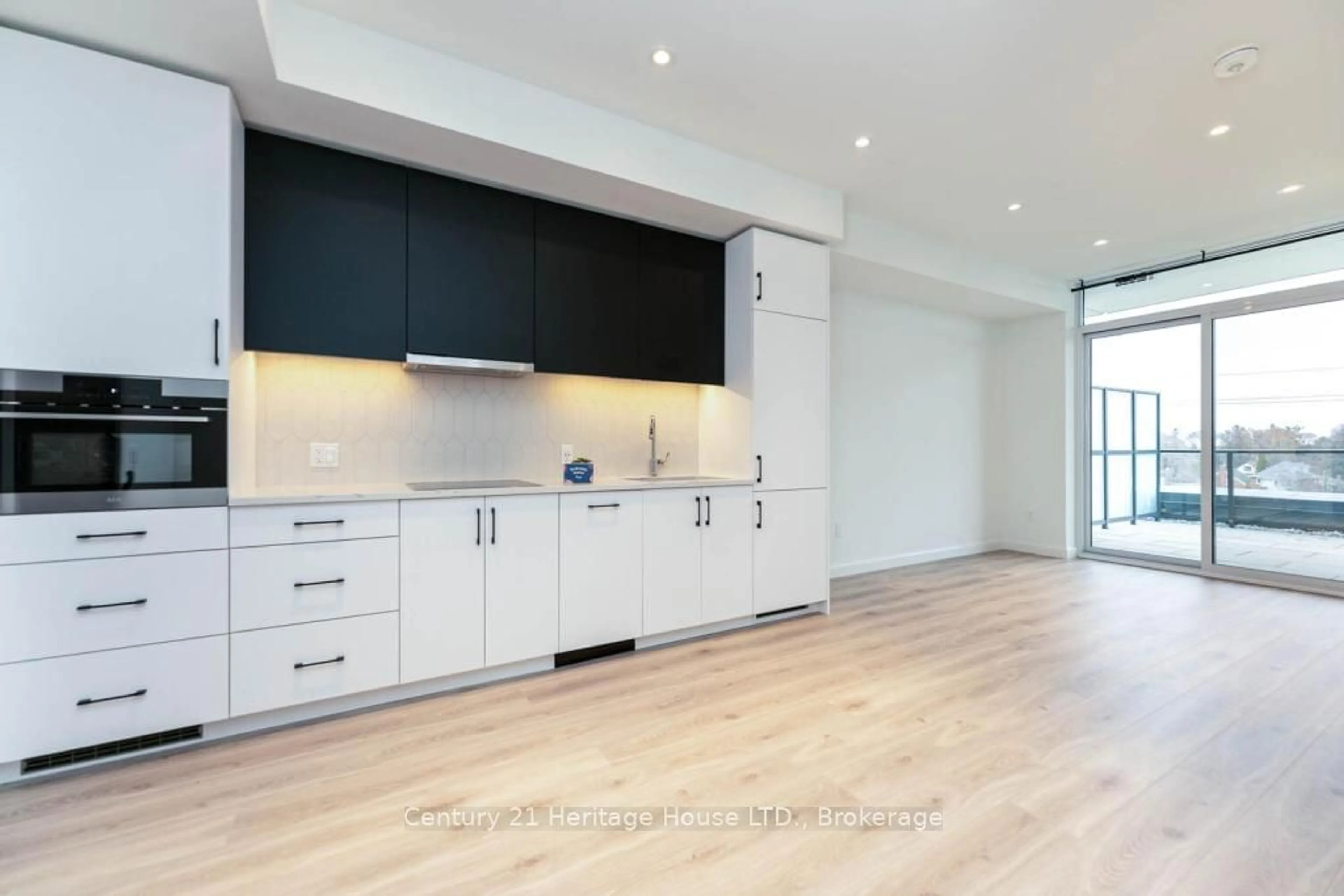 Open concept kitchen, wood/laminate floor for 741 King St #301, Kitchener Ontario N2G 0E9