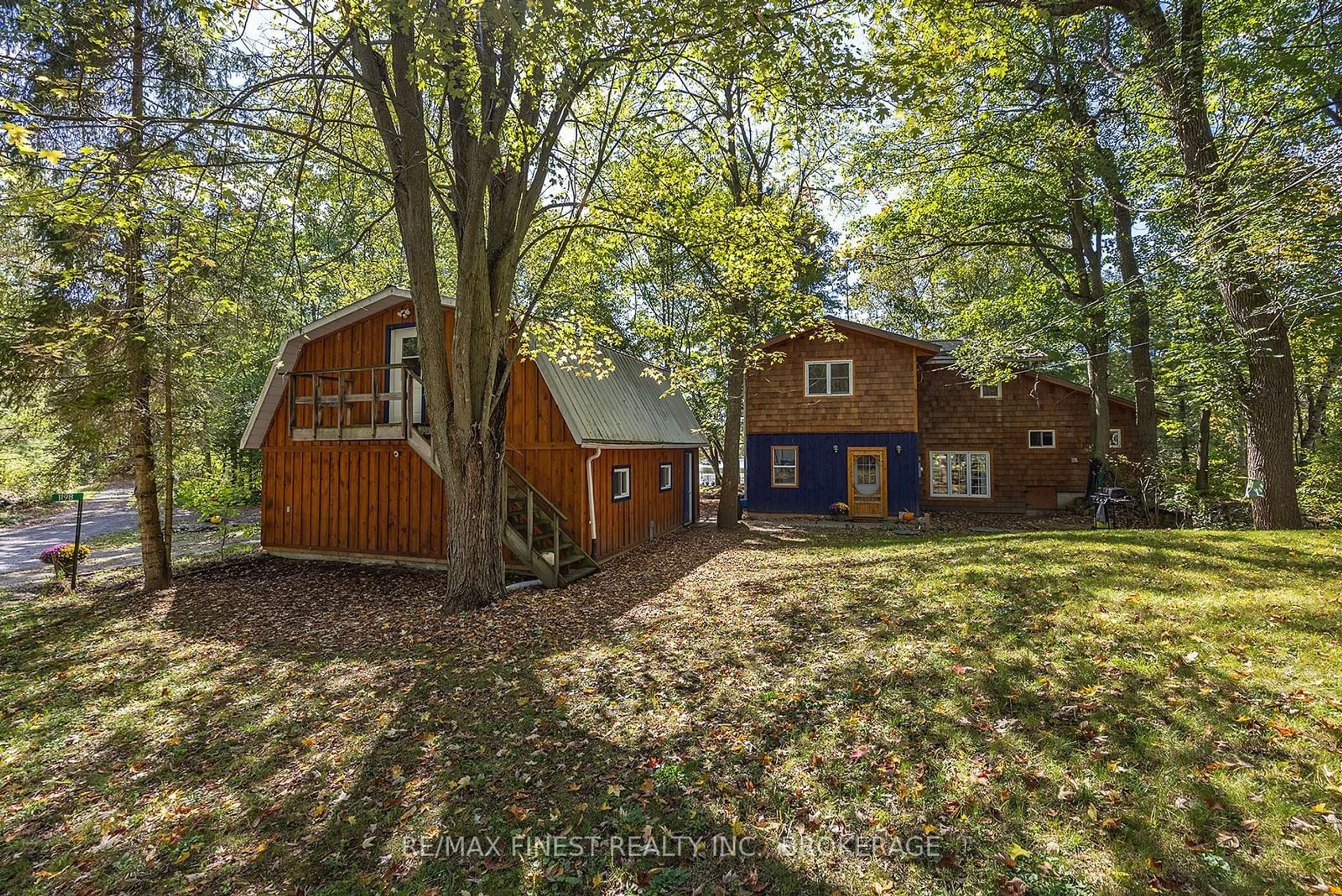 A pic from outside/outdoor area/front of a property/back of a property/a pic from drone, forest/trees view for 1198 NARROWS Lane, South Frontenac Ontario K0H 2L0