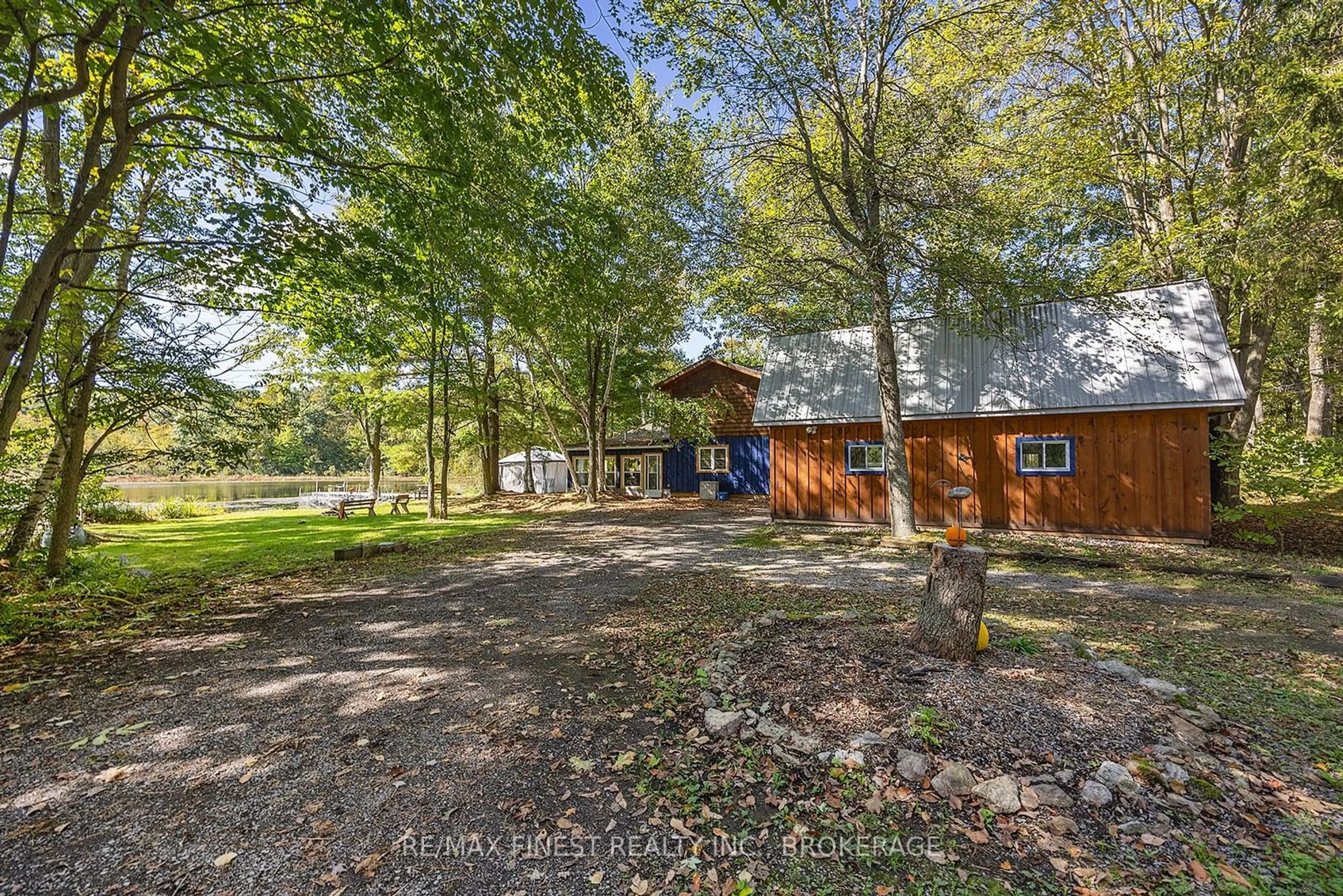 A pic from outside/outdoor area/front of a property/back of a property/a pic from drone, forest/trees view for 1198 NARROWS Lane, South Frontenac Ontario K0H 2L0