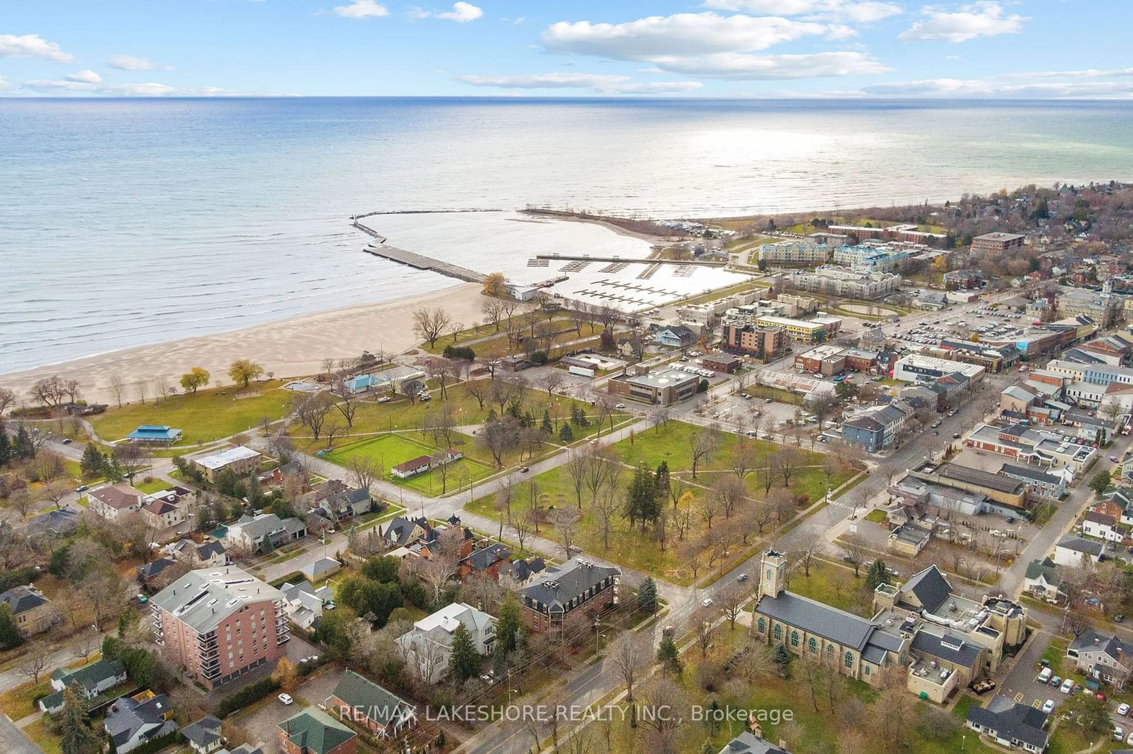 A pic from outside/outdoor area/front of a property/back of a property/a pic from drone, water/lake/river/ocean view for 220 Church St #101, Cobourg Ontario K9A 3V9