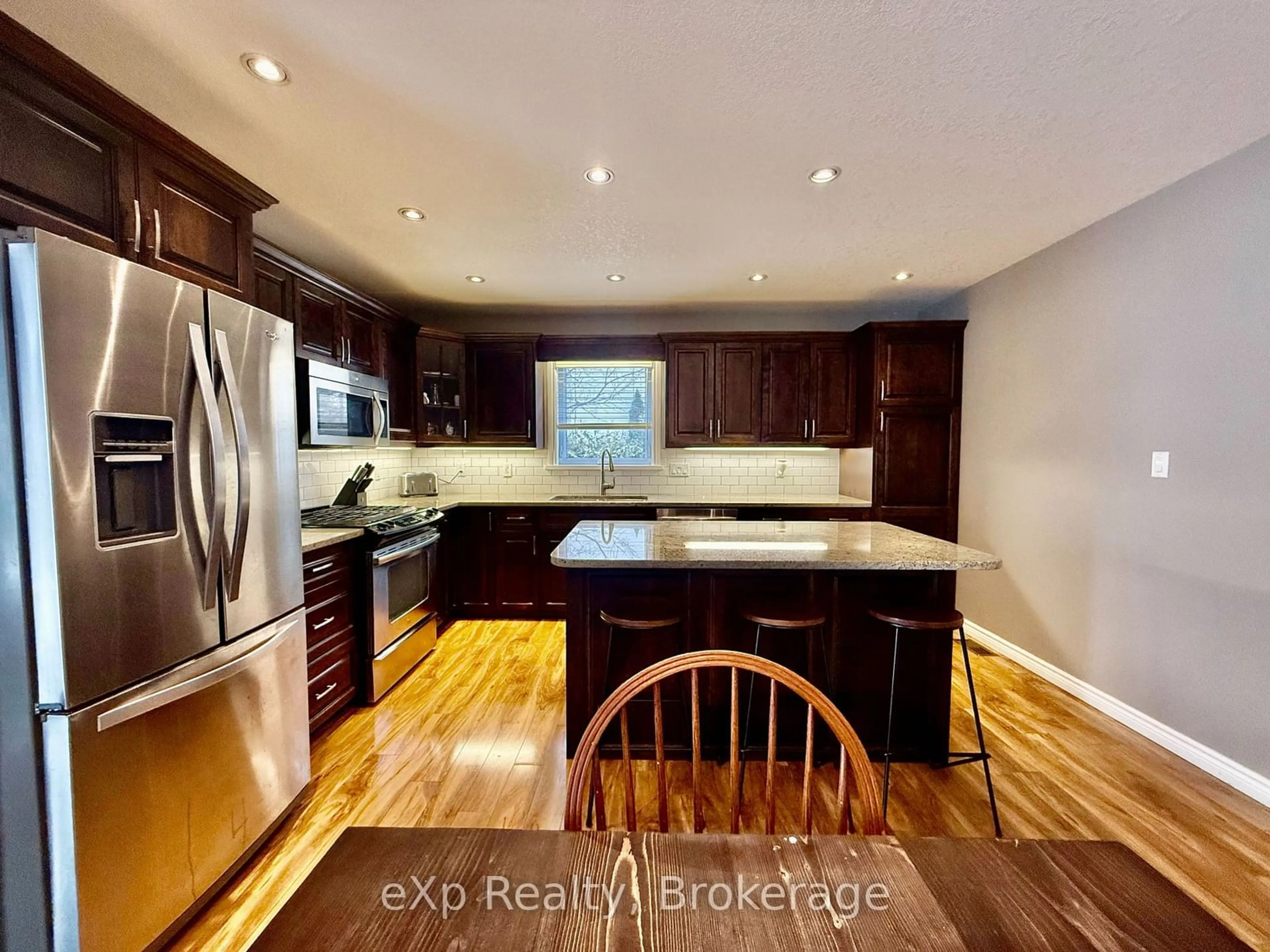 Open concept kitchen, wood/laminate floor for 11 Carroll St, South Bruce Ontario N0G 2J0