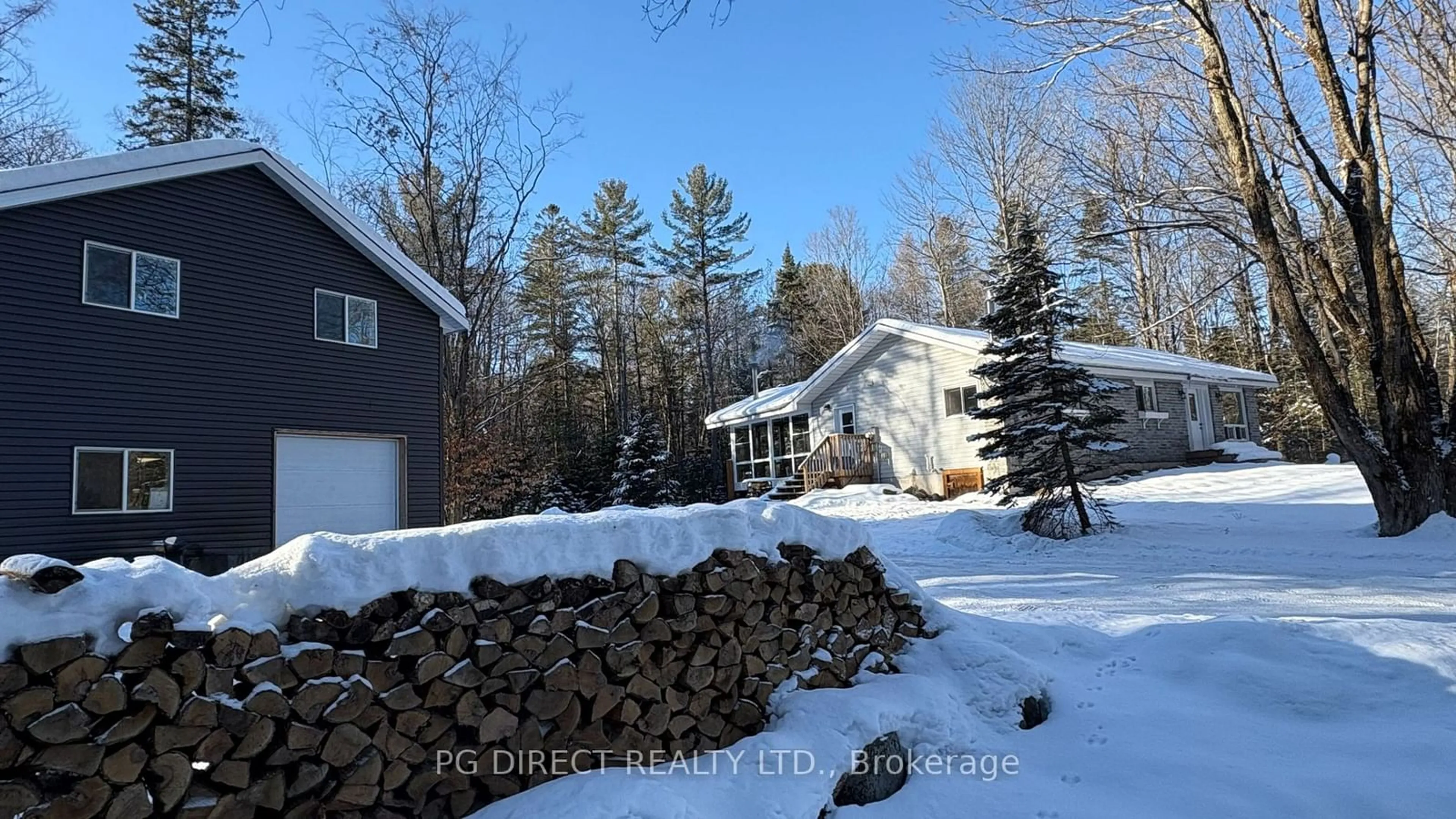 A pic from outside/outdoor area/front of a property/back of a property/a pic from drone, forest/trees view for 504 South Waseosa Lake Rd, Huntsville Ontario P1H 2N5