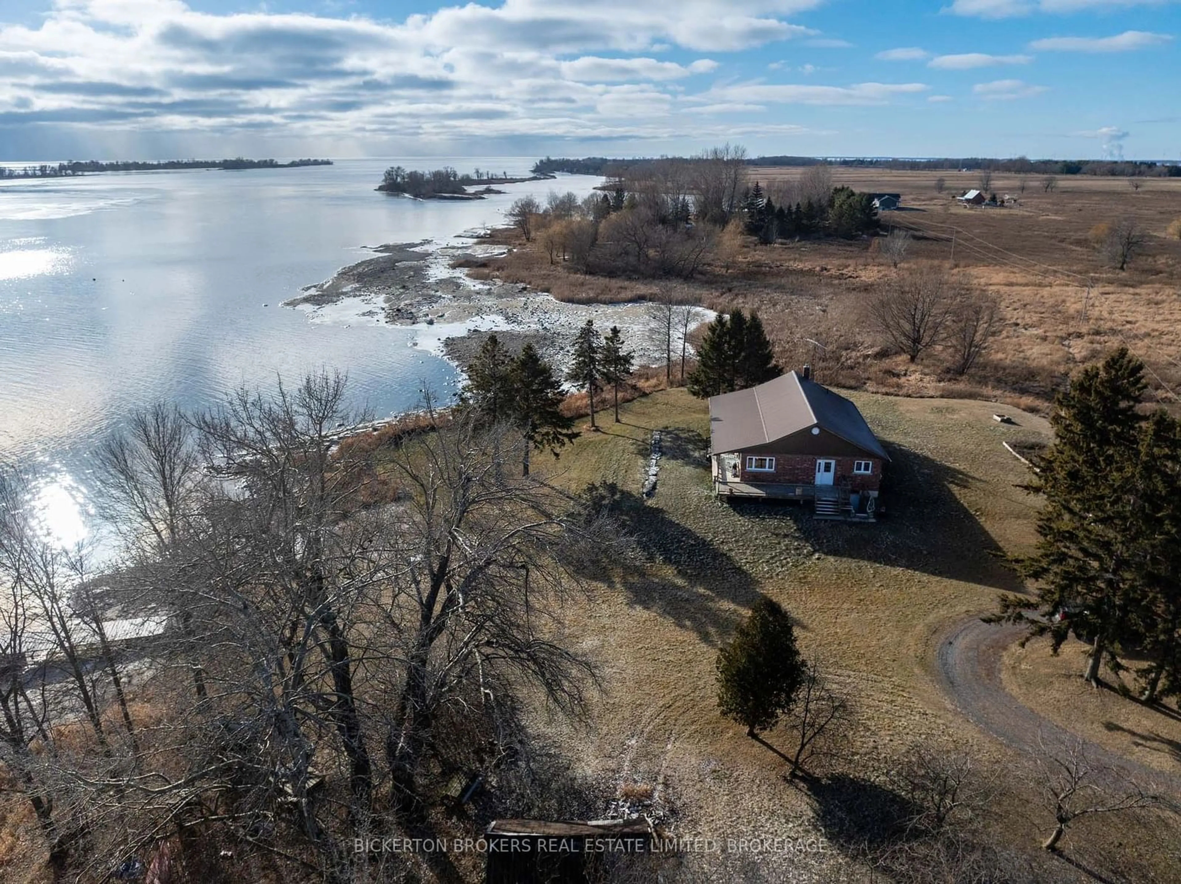 A pic from outside/outdoor area/front of a property/back of a property/a pic from drone, water/lake/river/ocean view for 1125 Nine Mile Point Rd, Wolfe Island Ontario K0H 2Y0