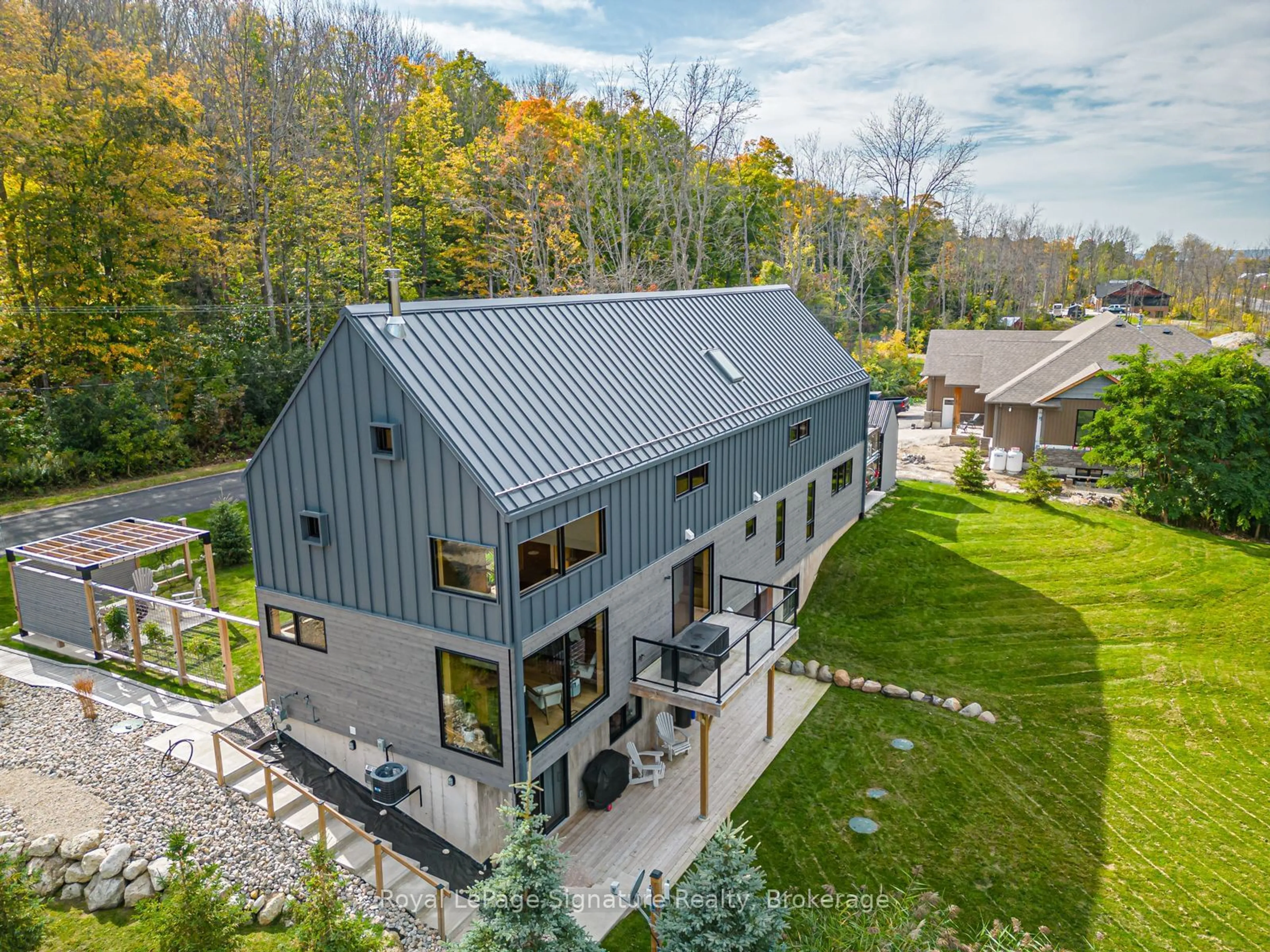 A pic from outside/outdoor area/front of a property/back of a property/a pic from drone, mountain view for 131 Old Highway 26, Meaford Ontario N4L 1W7