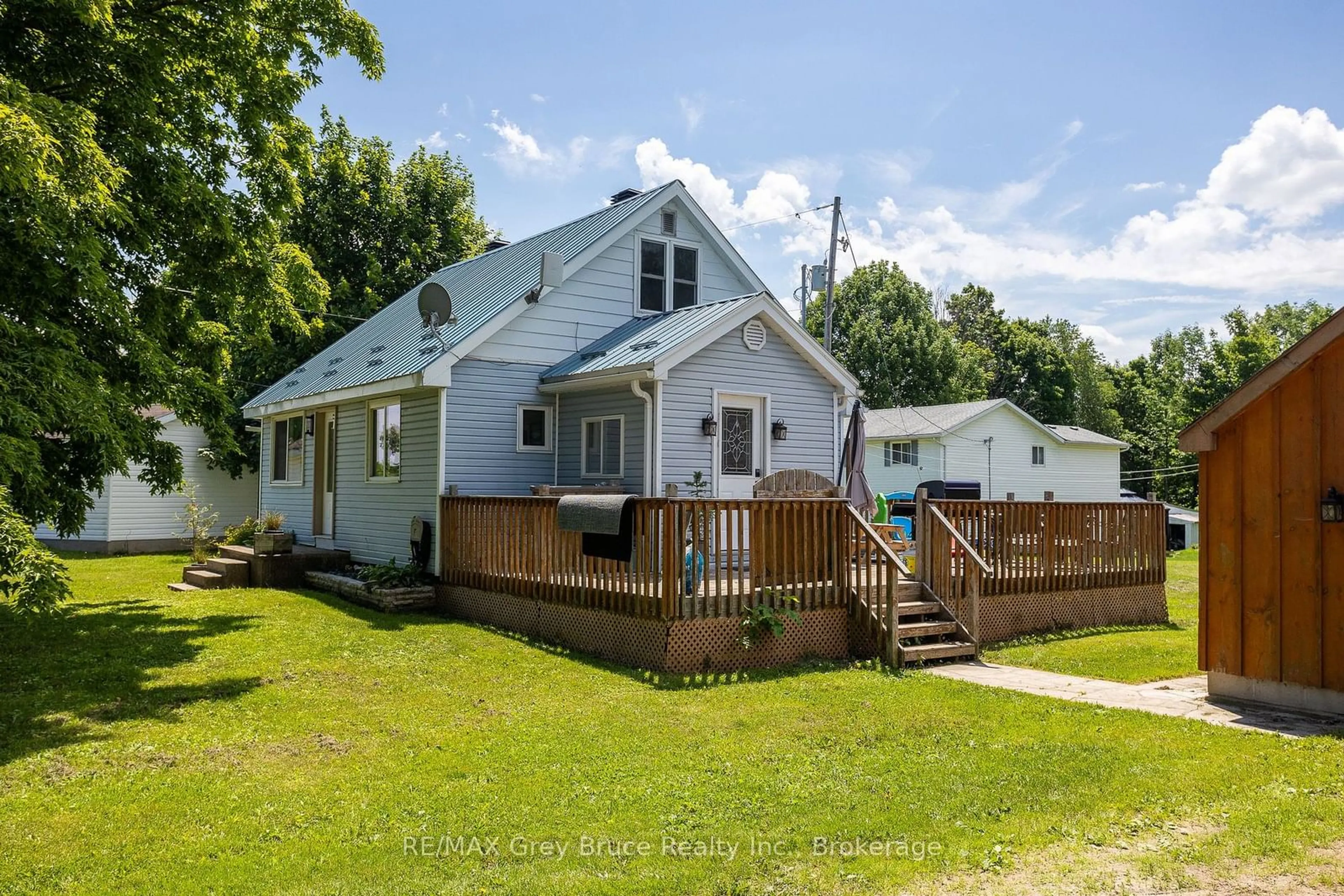 A pic from outside/outdoor area/front of a property/back of a property/a pic from drone, street for 718100 Highway 6, Georgian Bluffs Ontario N4K 5N7