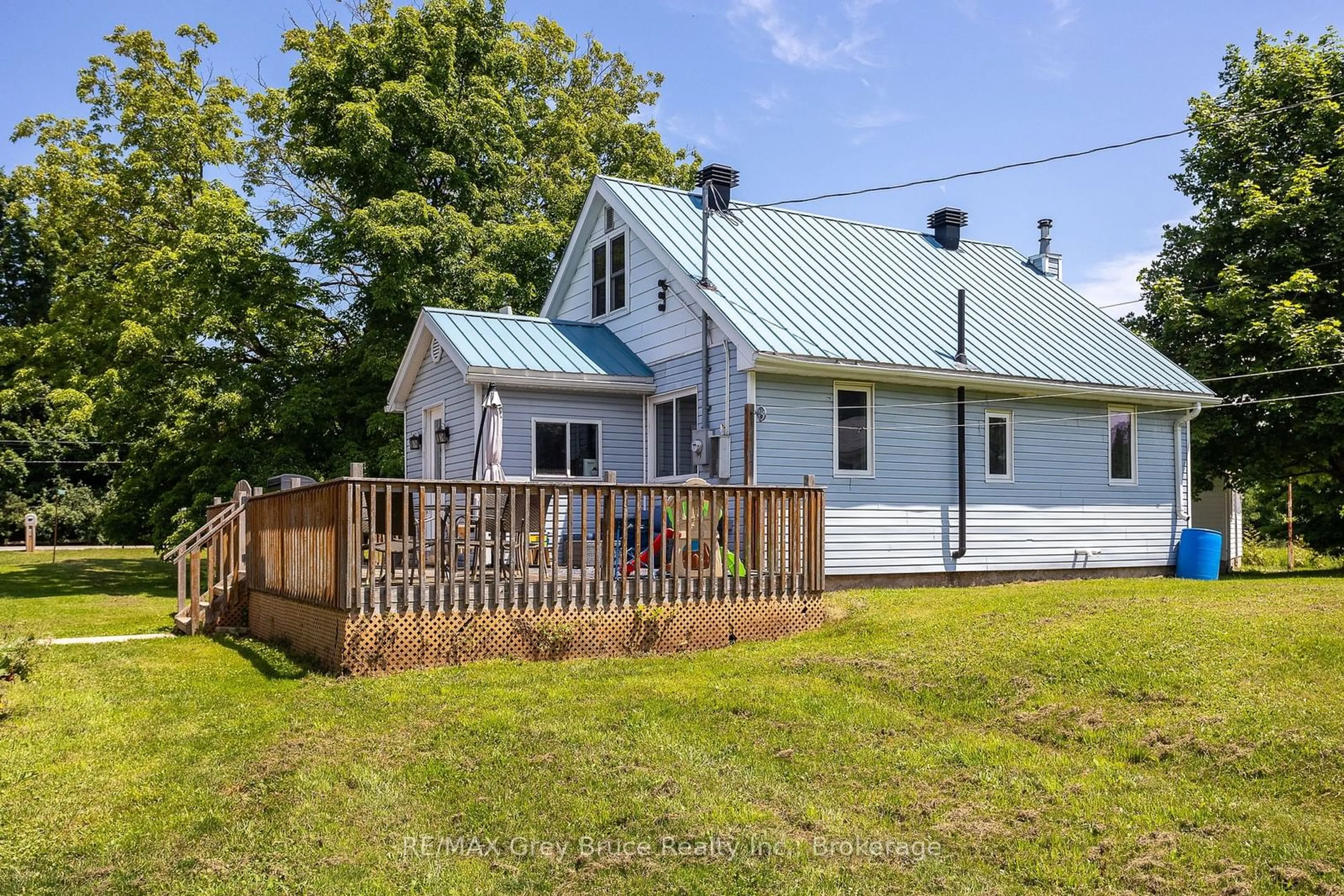 A pic from outside/outdoor area/front of a property/back of a property/a pic from drone, unknown for 718100 Highway 6, Georgian Bluffs Ontario N4K 5N7