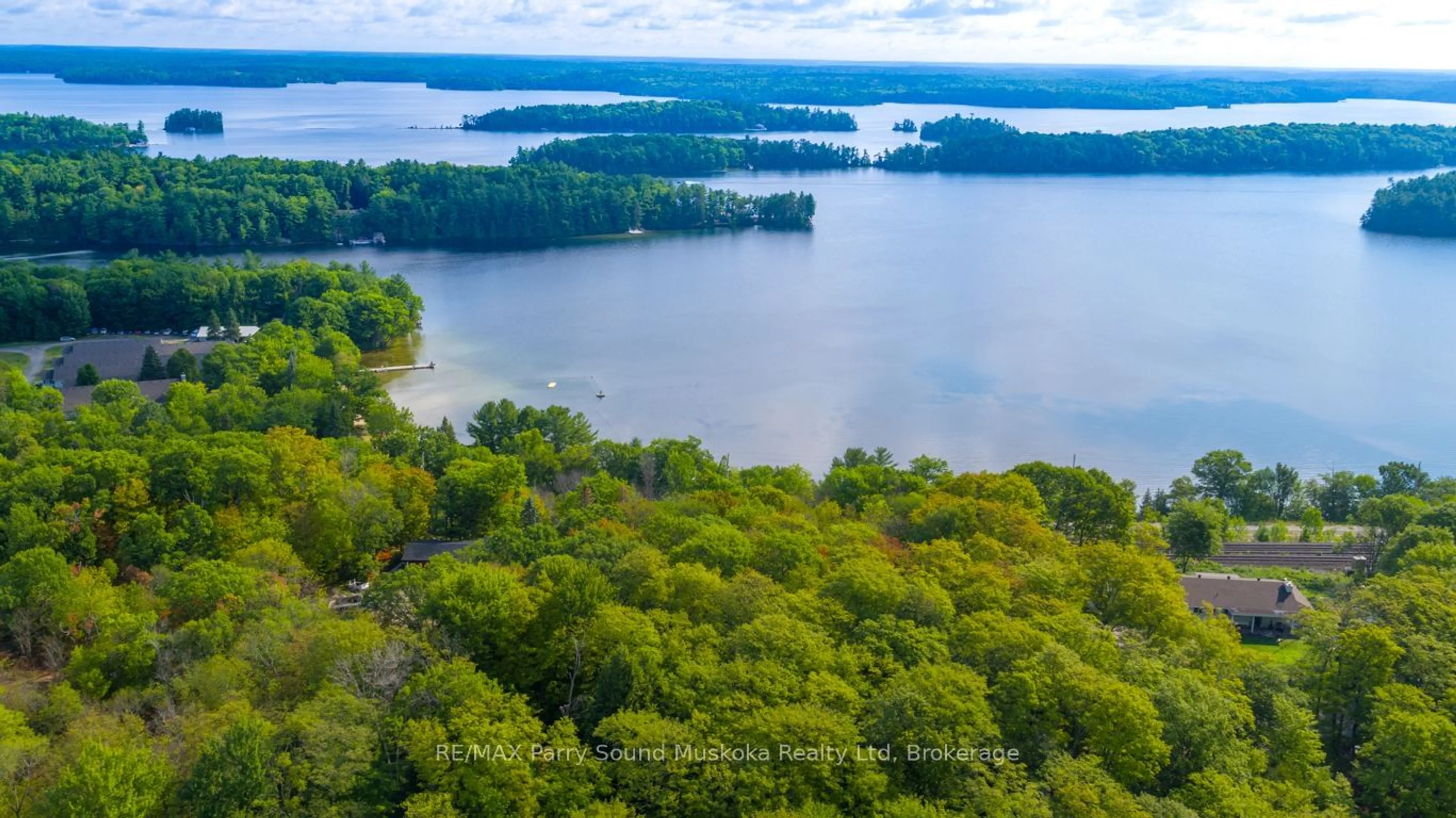 A pic from outside/outdoor area/front of a property/back of a property/a pic from drone, water/lake/river/ocean view for 143A Highway 612, Seguin Ontario P0C 1H0