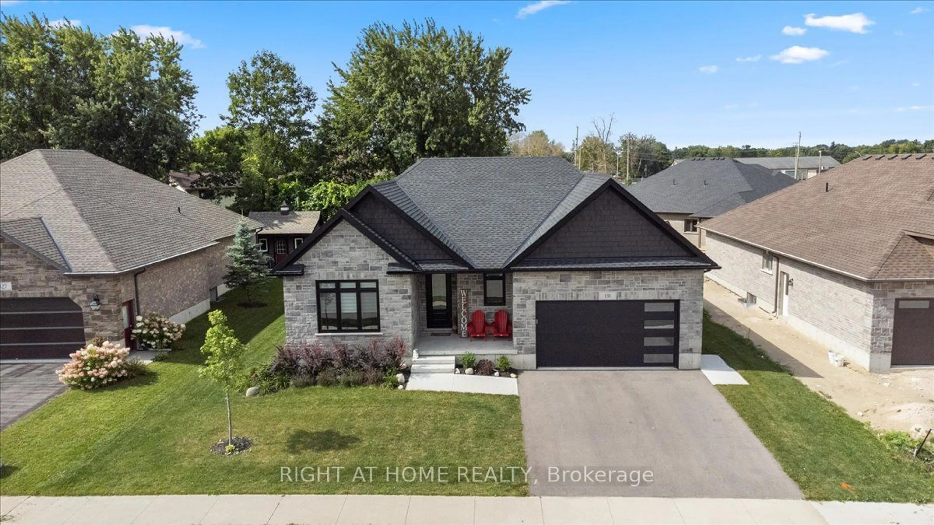 Home with brick exterior material, street for 131 Ronnies Way, Wellington North Ontario N0G 2L2