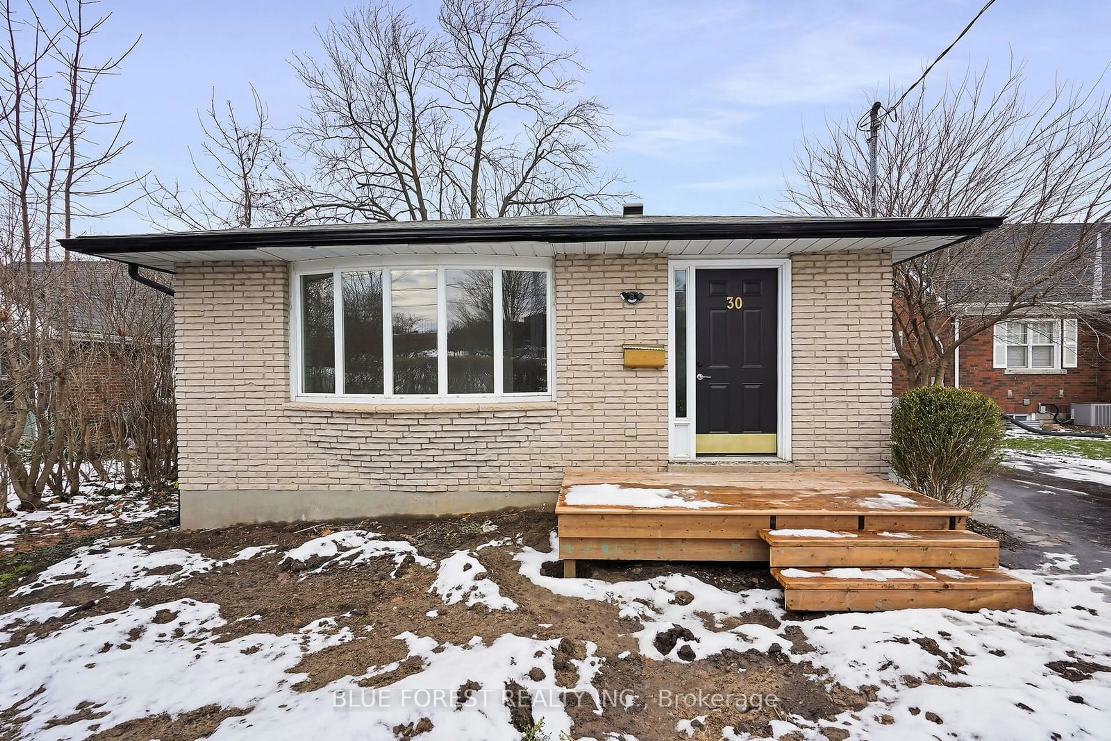 Home with brick exterior material, street for 30 Baseline Rd, London Ontario N6C 2N5