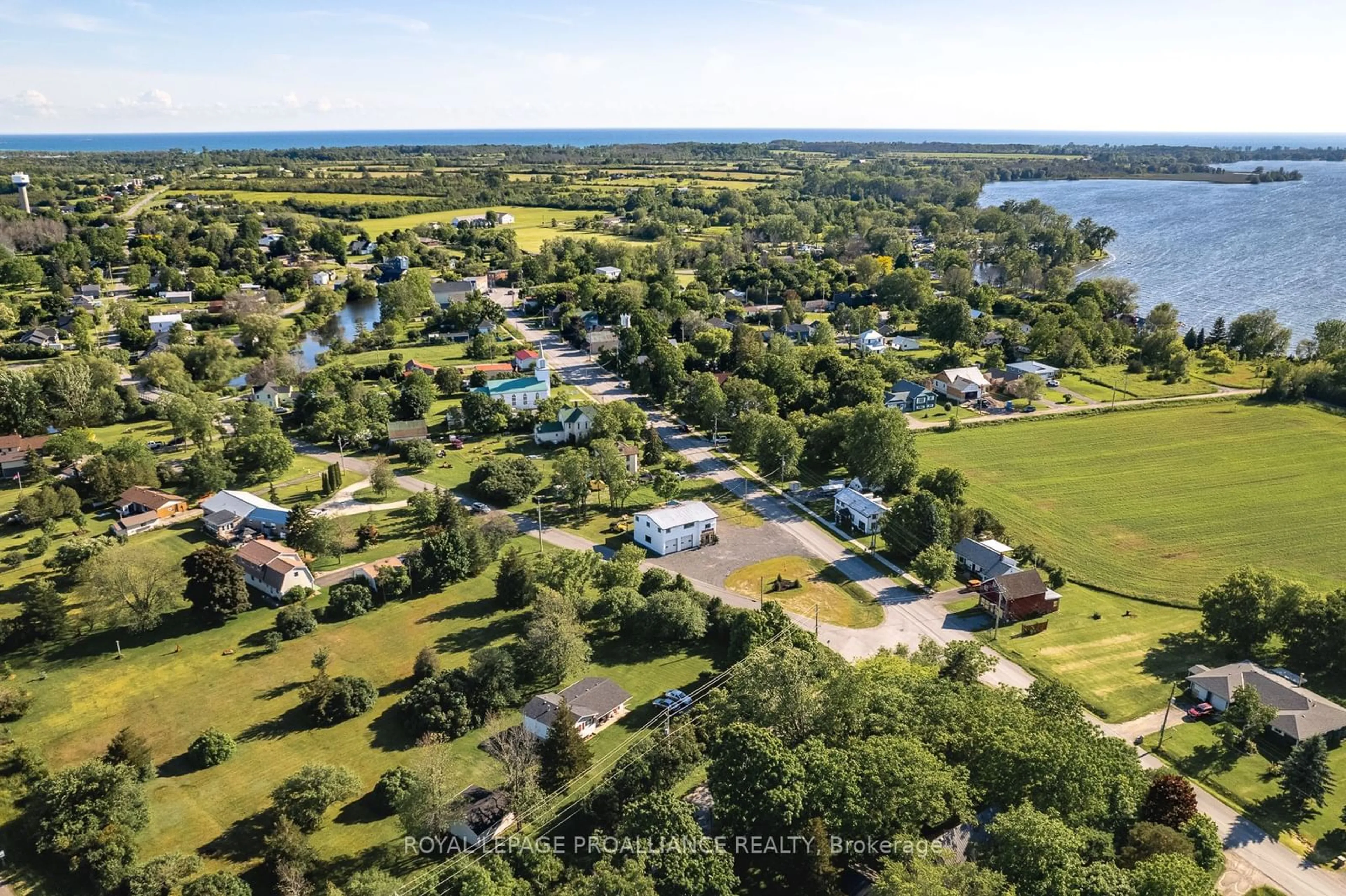 A pic from outside/outdoor area/front of a property/back of a property/a pic from drone, water/lake/river/ocean view for 248 Consecon Main St, Prince Edward County Ontario K0K 1T0