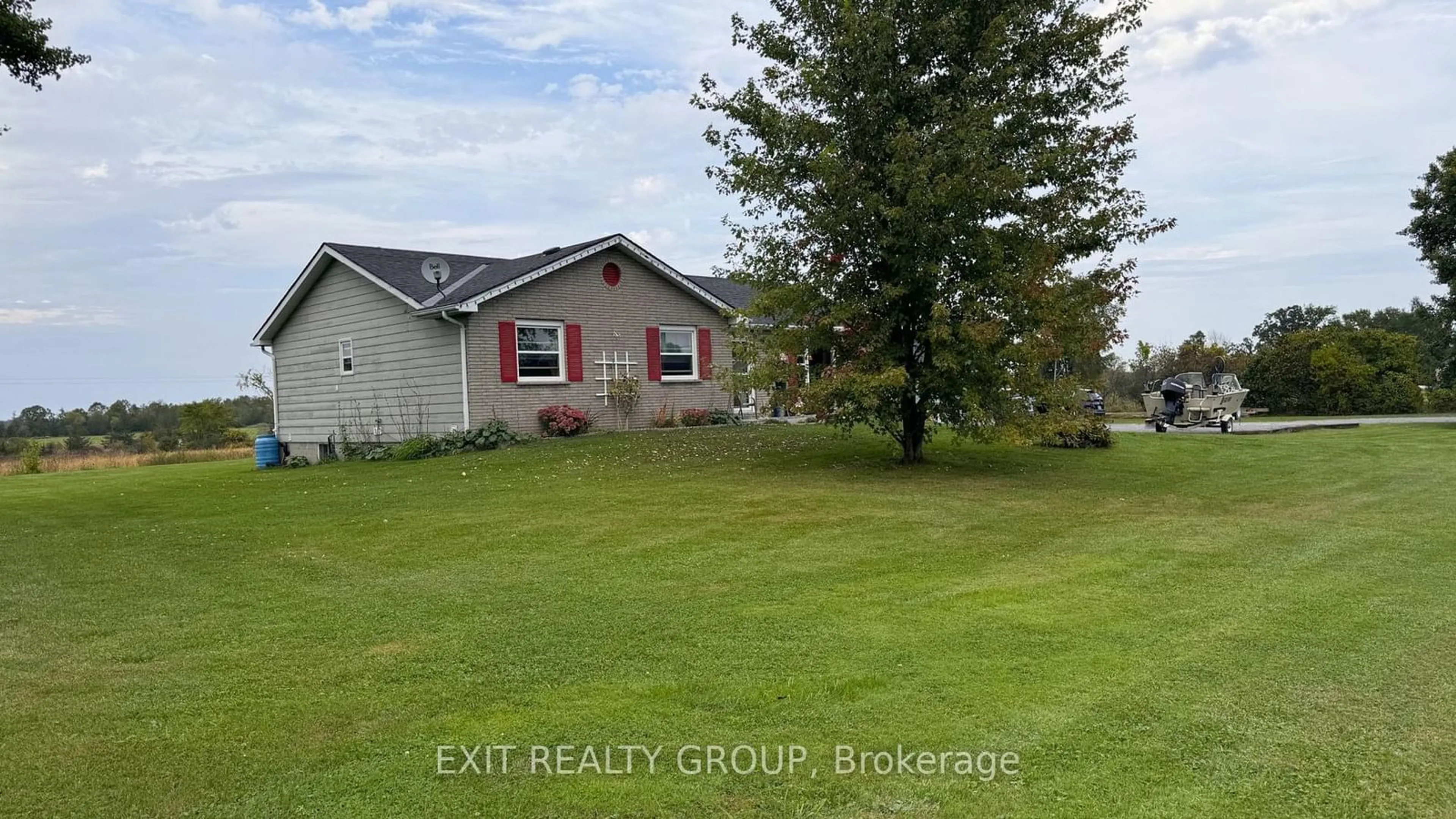 A pic from outside/outdoor area/front of a property/back of a property/a pic from drone, water/lake/river/ocean view for 105 County Road 12, Greater Napanee Ontario K0K 2W0