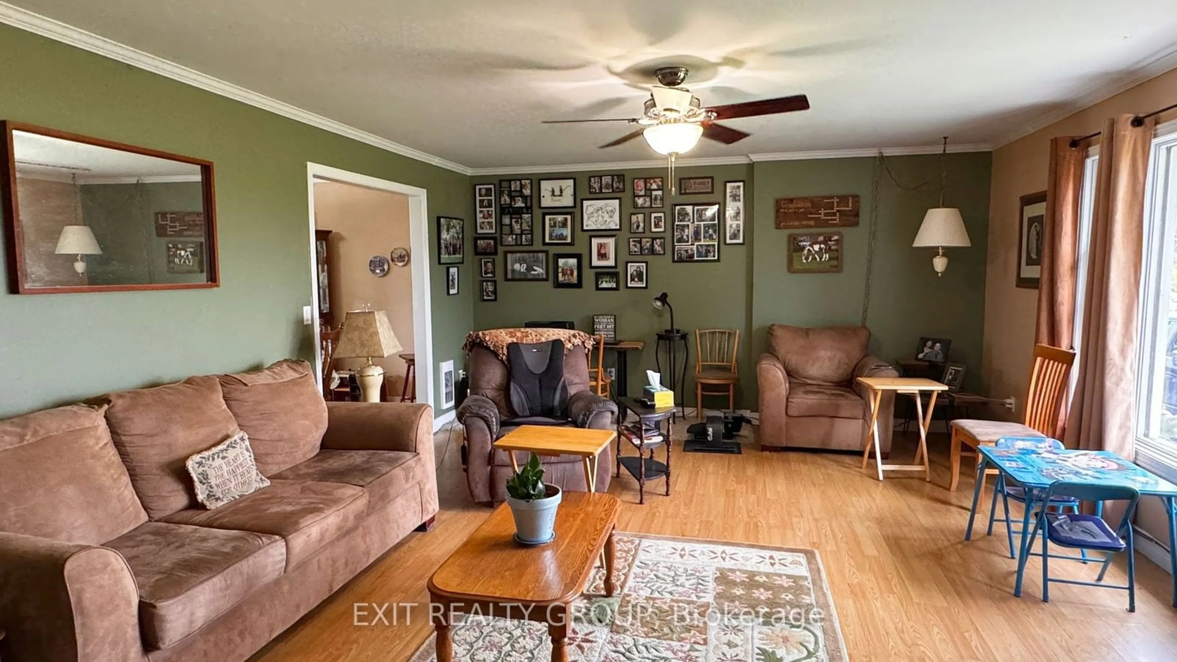 Living room with furniture, wood/laminate floor for 105 County Road 12, Greater Napanee Ontario K0K 2W0