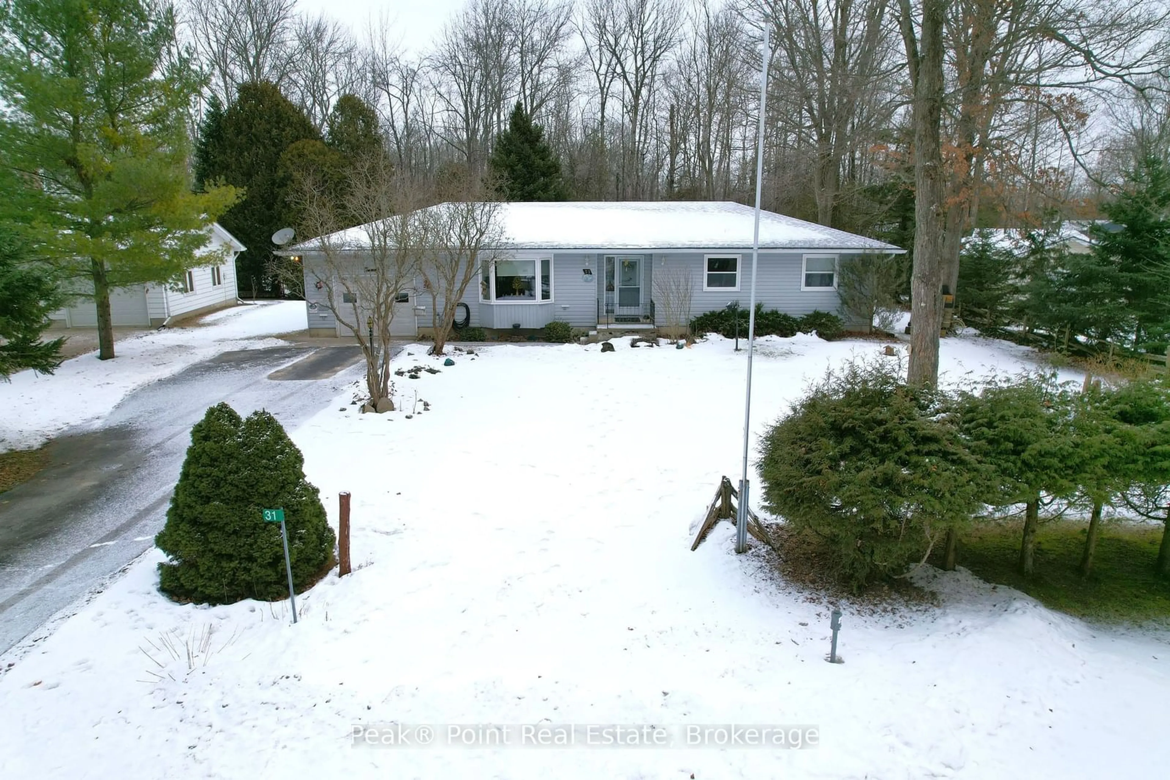 A pic from outside/outdoor area/front of a property/back of a property/a pic from drone, unknown for 31 Dorena Cres, South Bruce Peninsula Ontario N0H 2G0