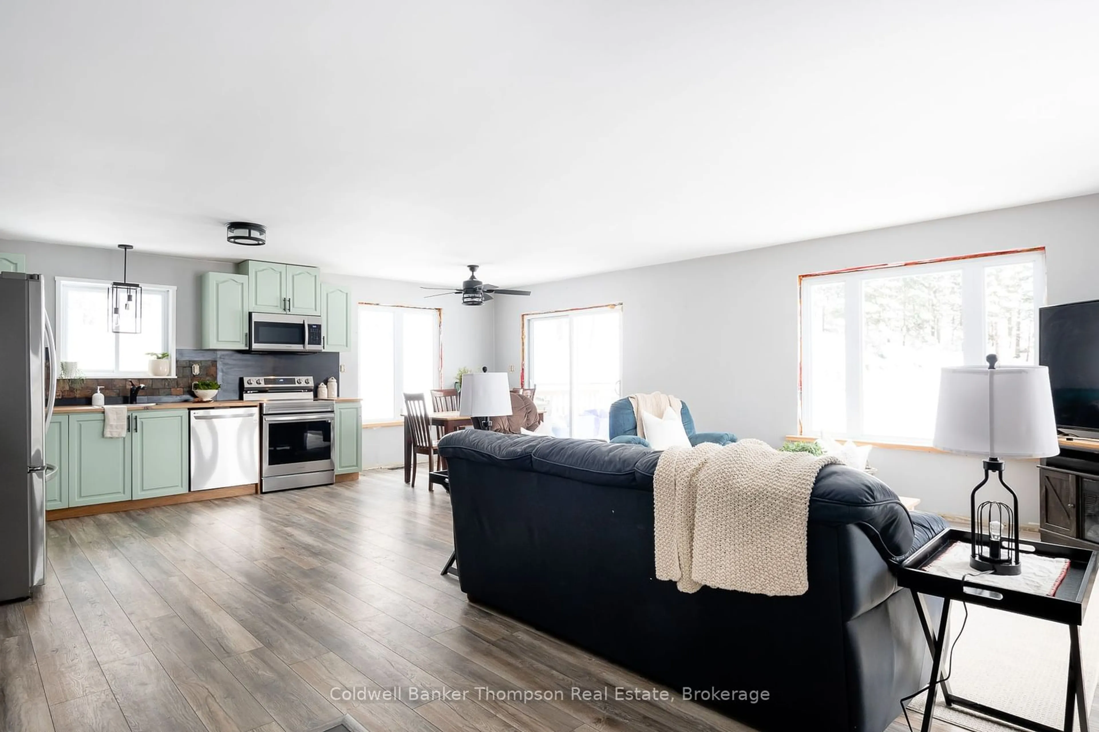 Living room with furniture, wood/laminate floor for 751 Old Muskoka Rd, Huntsville Ontario P0B 1M0