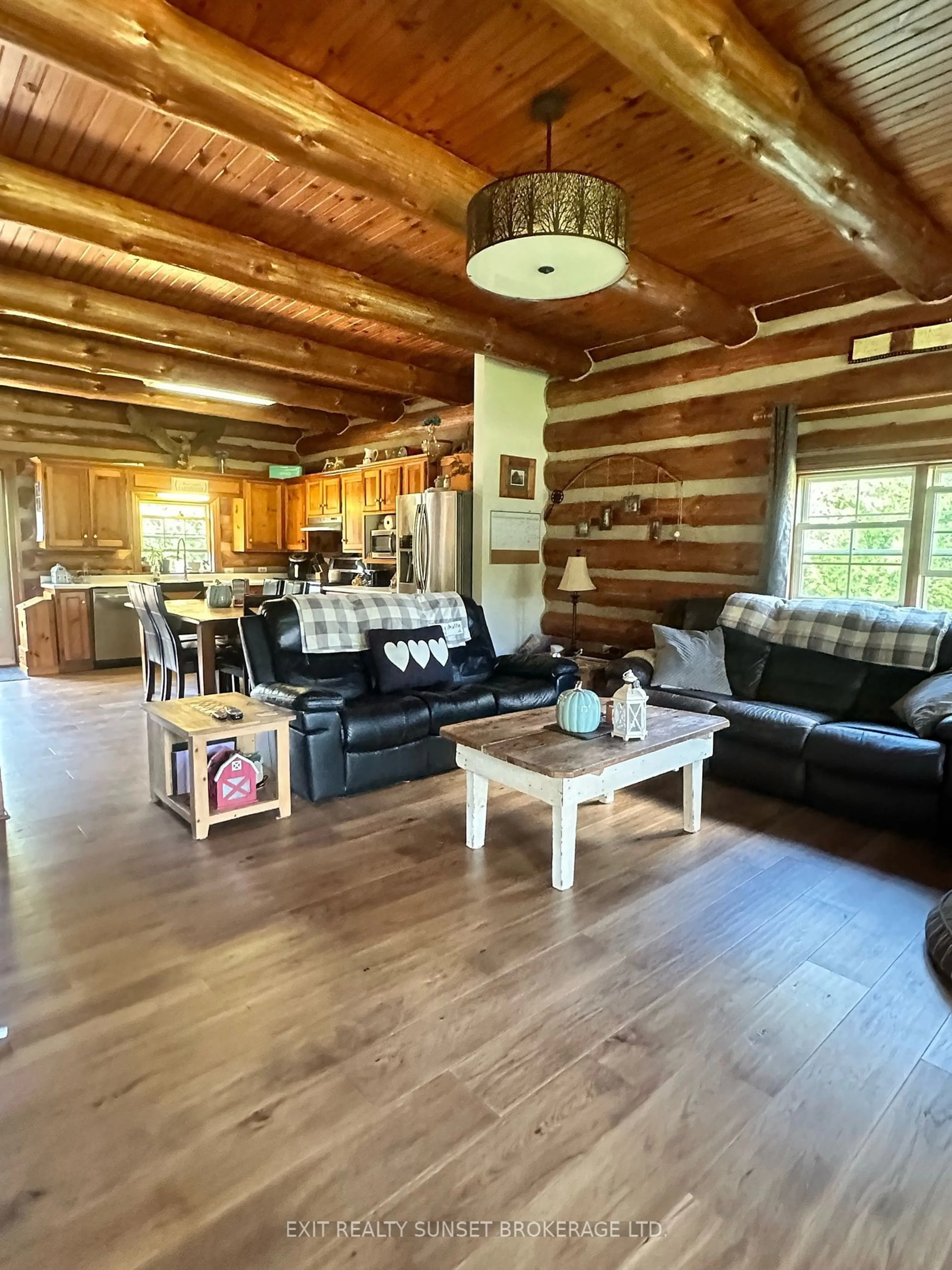 Living room with furniture, wood/laminate floor for 91 Spen Haven Rd, Kawartha Lakes Ontario K9V 4R6