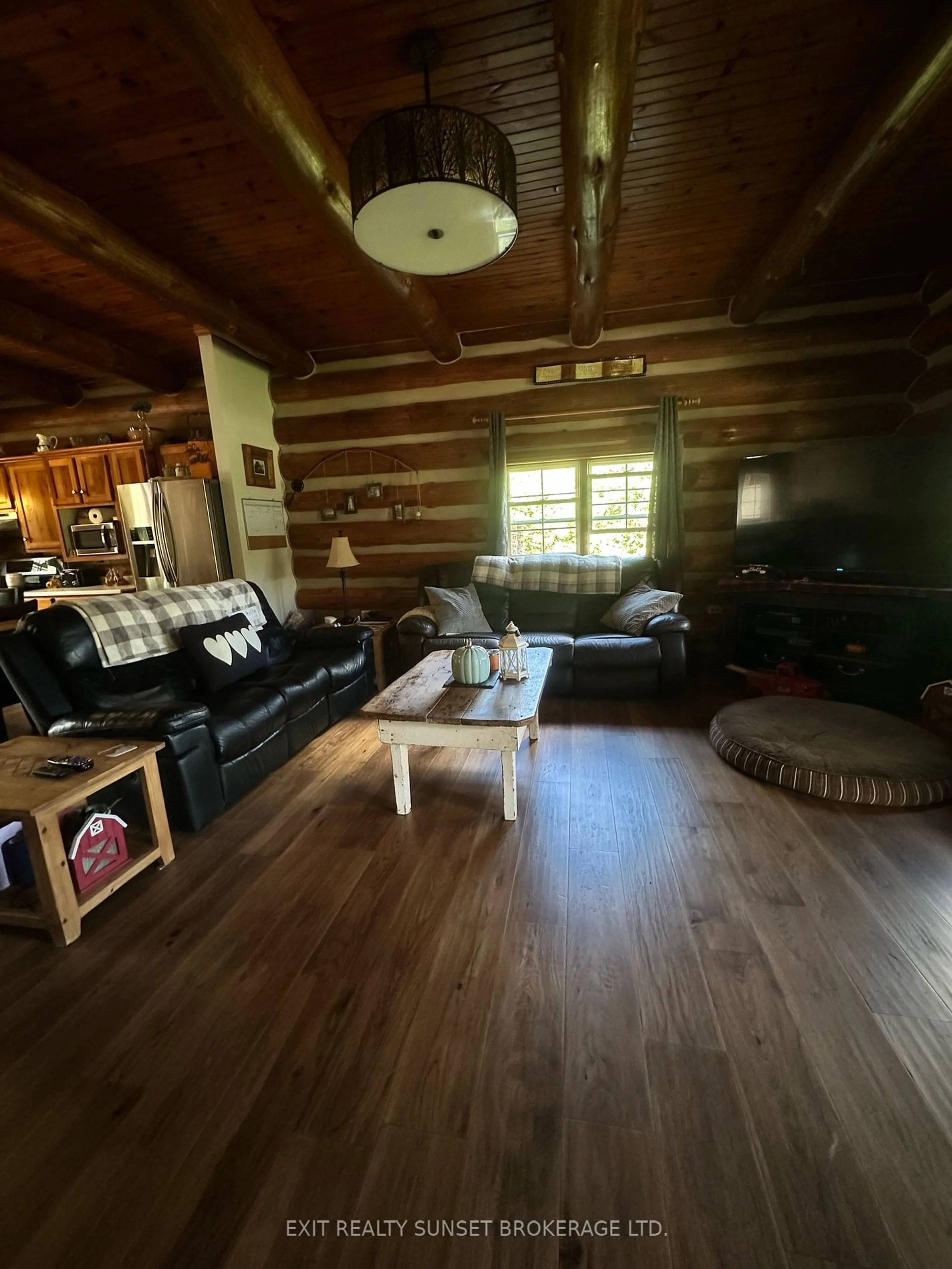 Living room with furniture, wood/laminate floor for 91 Spen Haven Rd, Kawartha Lakes Ontario K9V 4R6