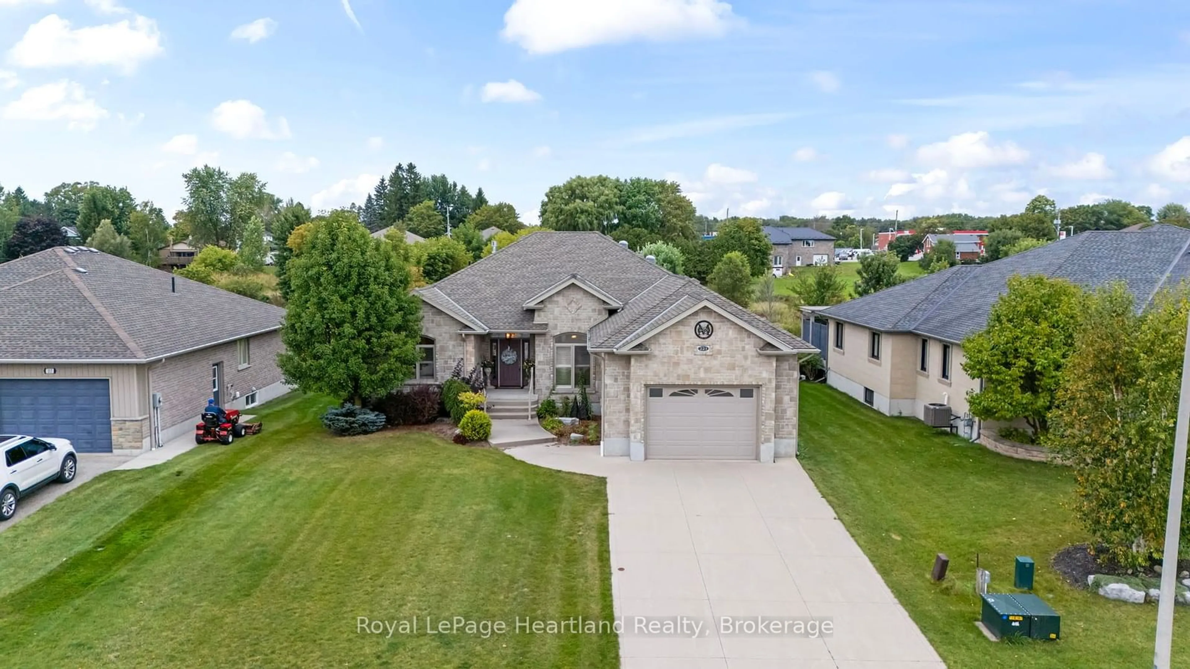 A pic from outside/outdoor area/front of a property/back of a property/a pic from drone, street for 221 JOHN St, Minto Ontario N0G 1Z0