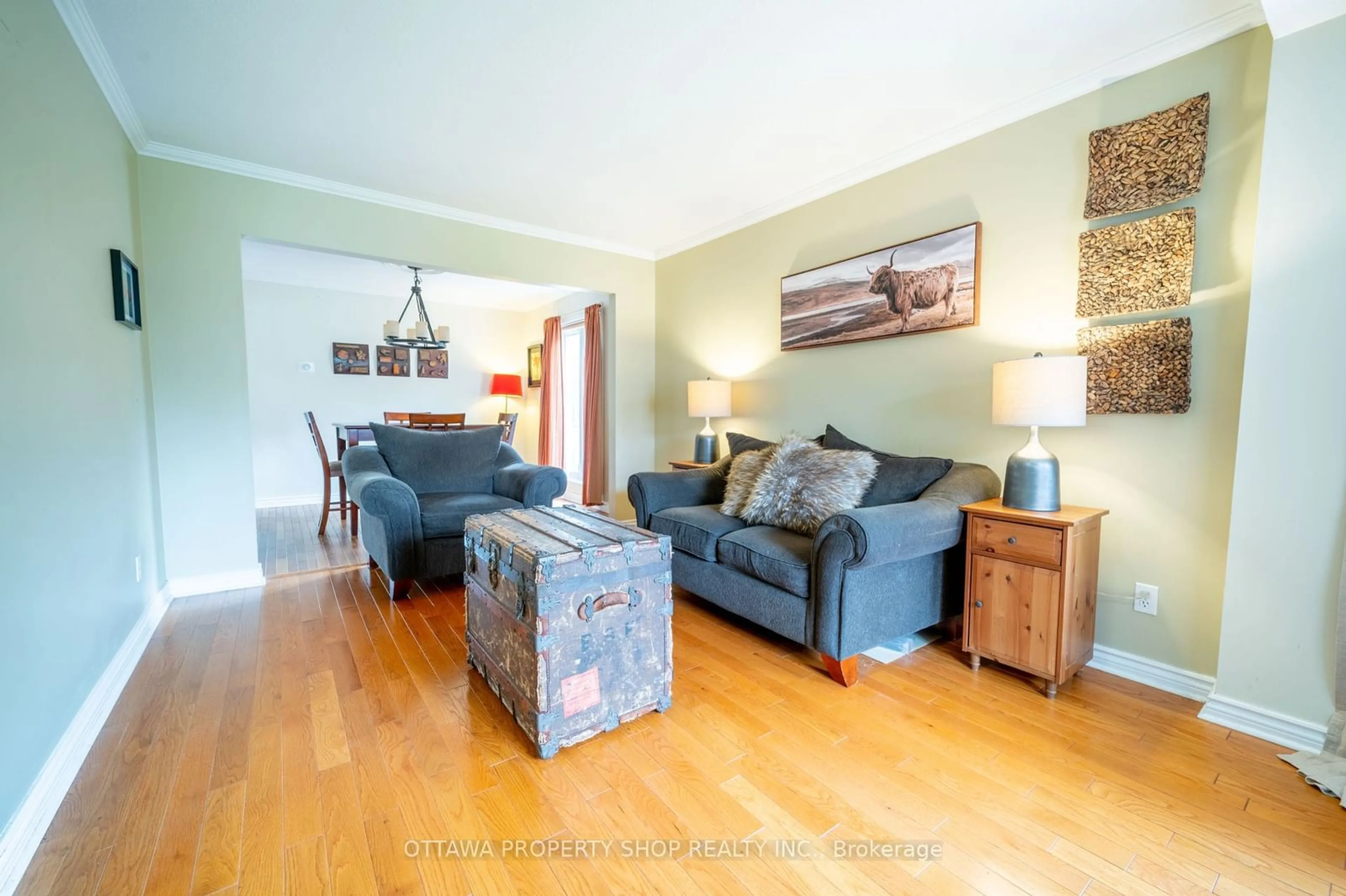 Living room with furniture, wood/laminate floor for 1651 Westport Cres, Orleans - Convent Glen and Area Ontario K1C 6C4