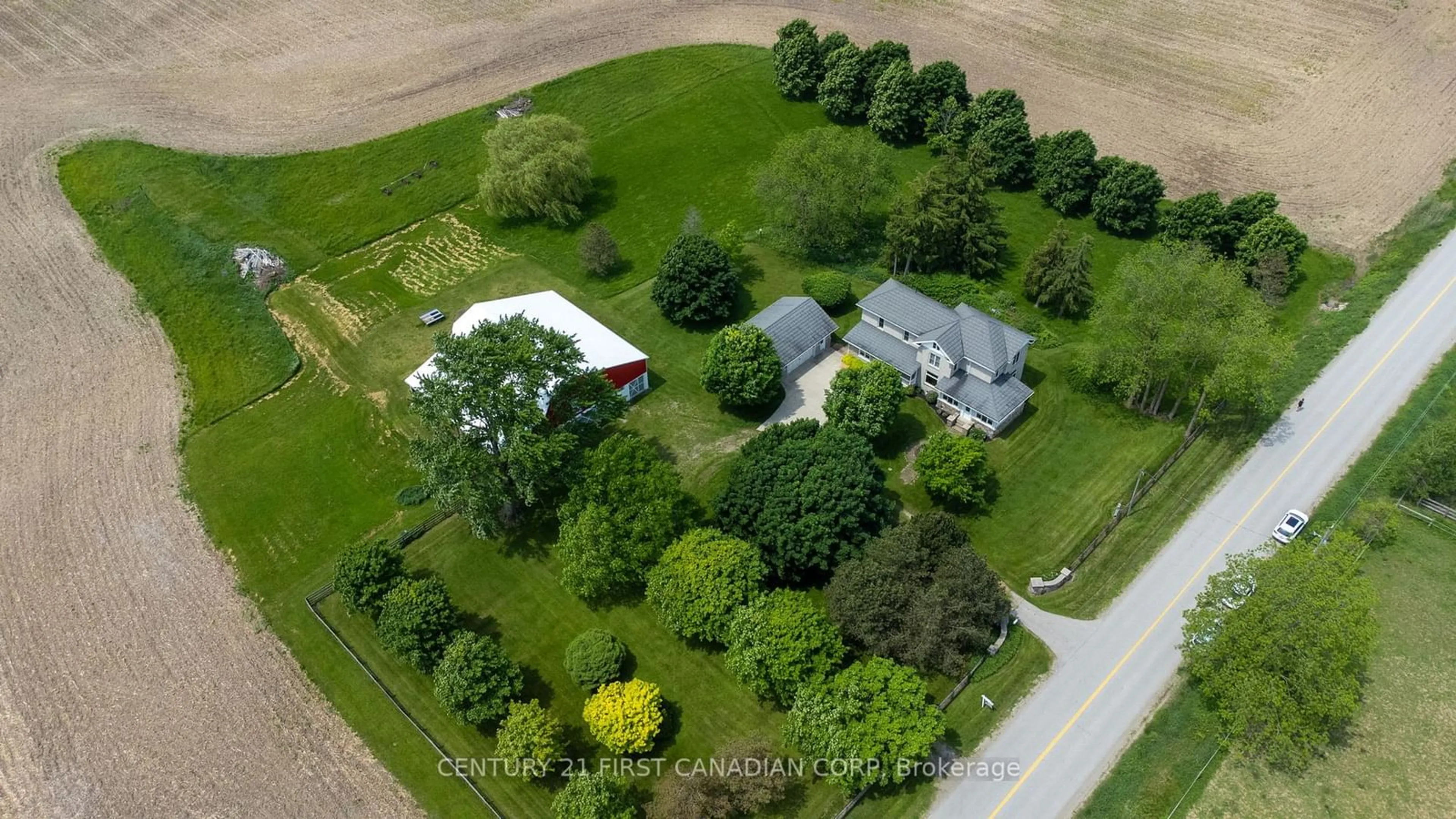 A pic from outside/outdoor area/front of a property/back of a property/a pic from drone, street for 24885 Poplar Hill Rd, Middlesex Centre Ontario N0M 1P0