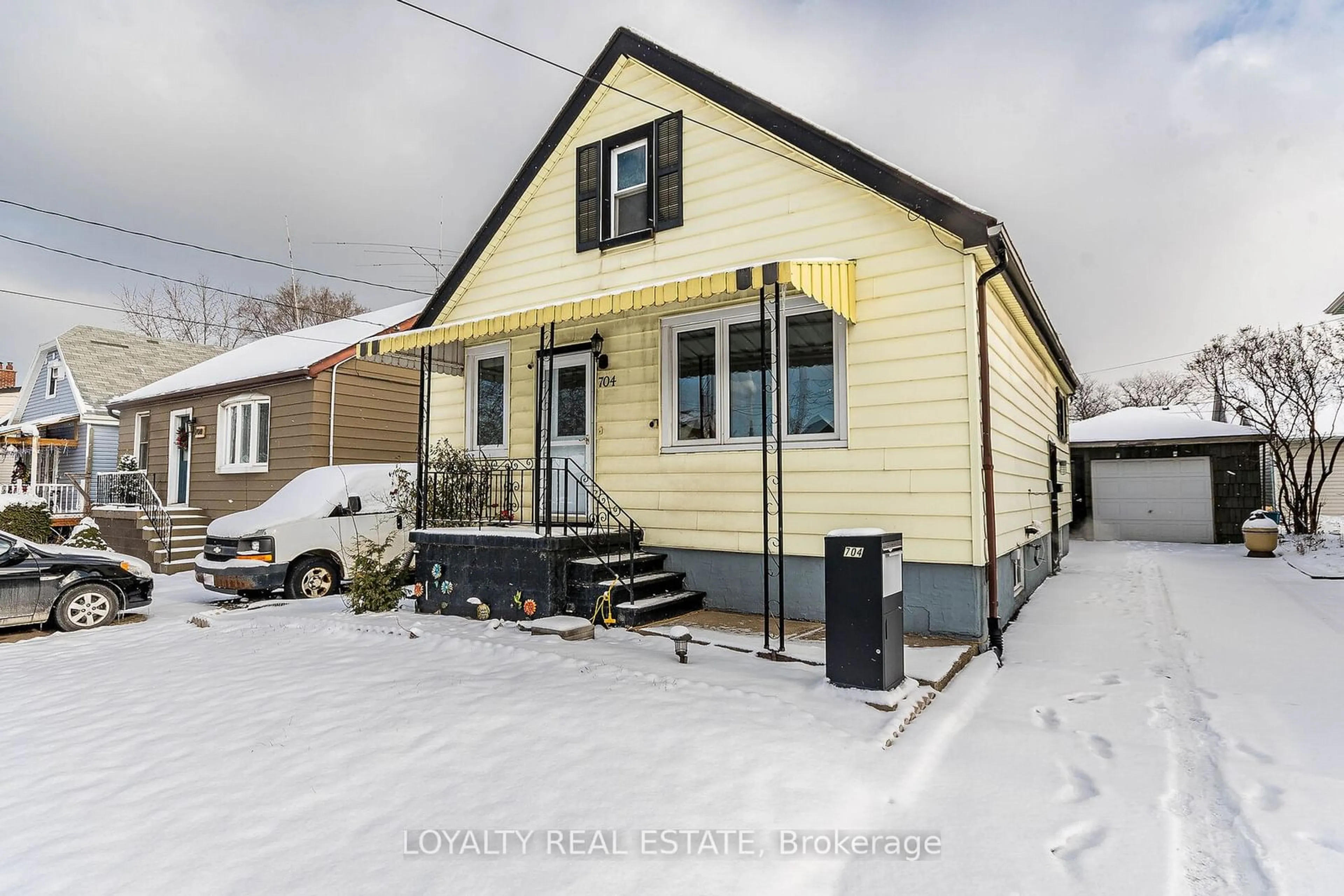 Home with vinyl exterior material, street for 704 Burgess Ave, Hamilton Ontario L8H 6J4