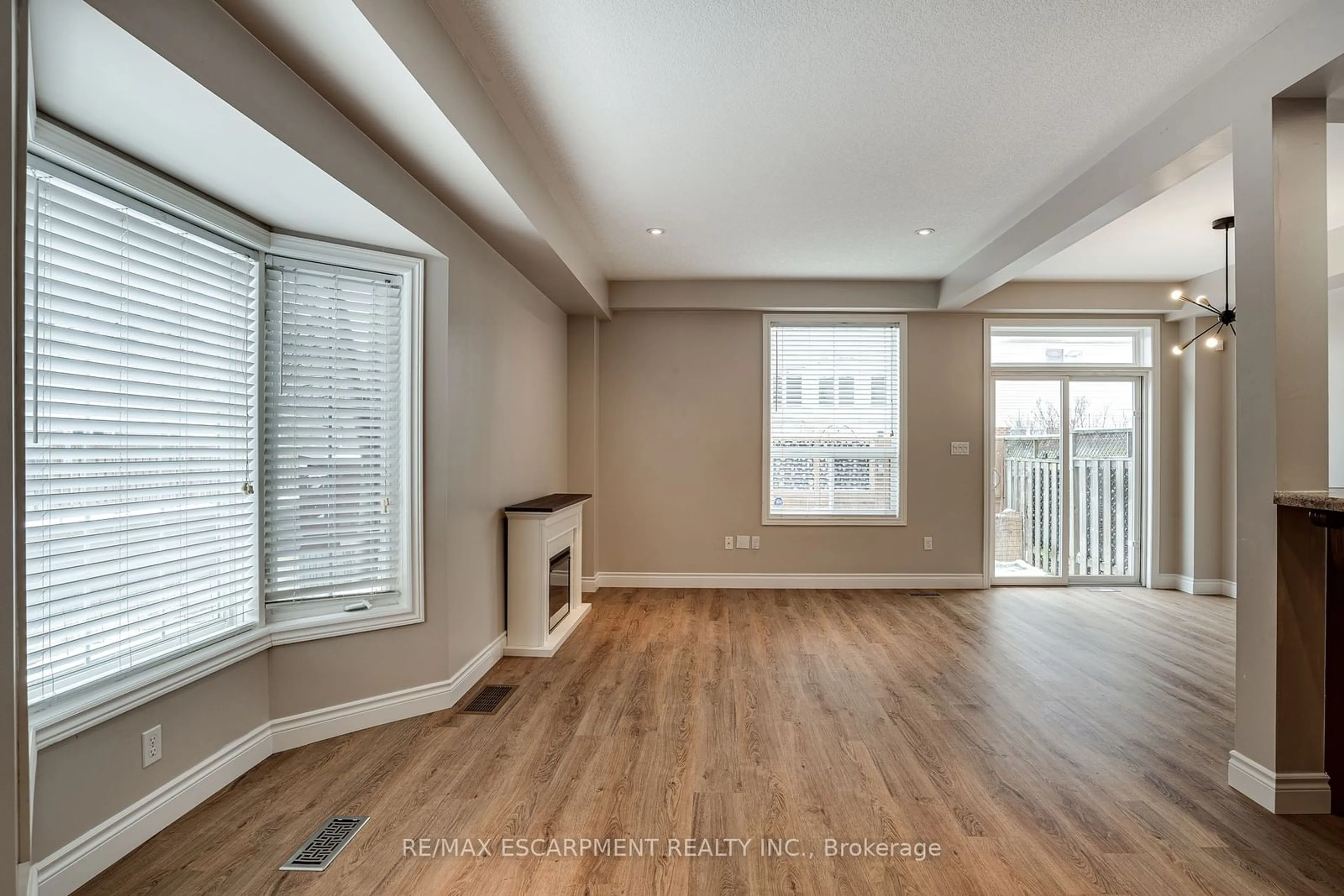 Living room with furniture, wood/laminate floor for 24 Marina Point Cres, Hamilton Ontario L8E 0E4