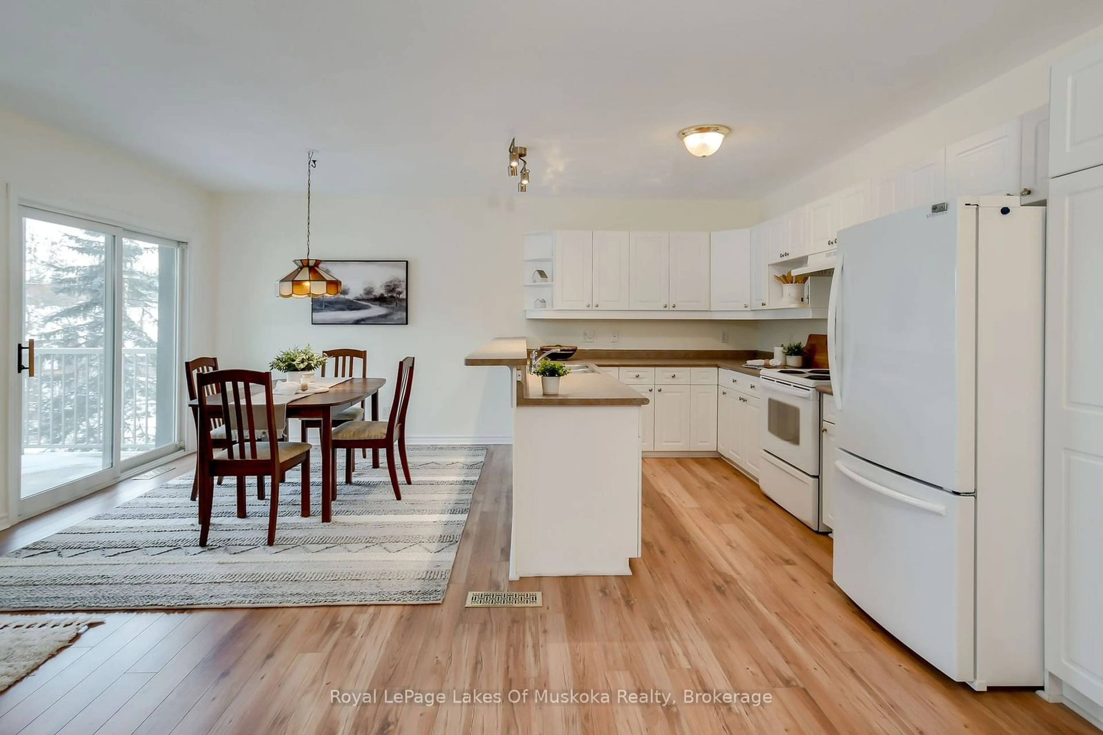 Open concept kitchen, wood/laminate floor for 24 Ontario St #309, Bracebridge Ontario P1L 2H5