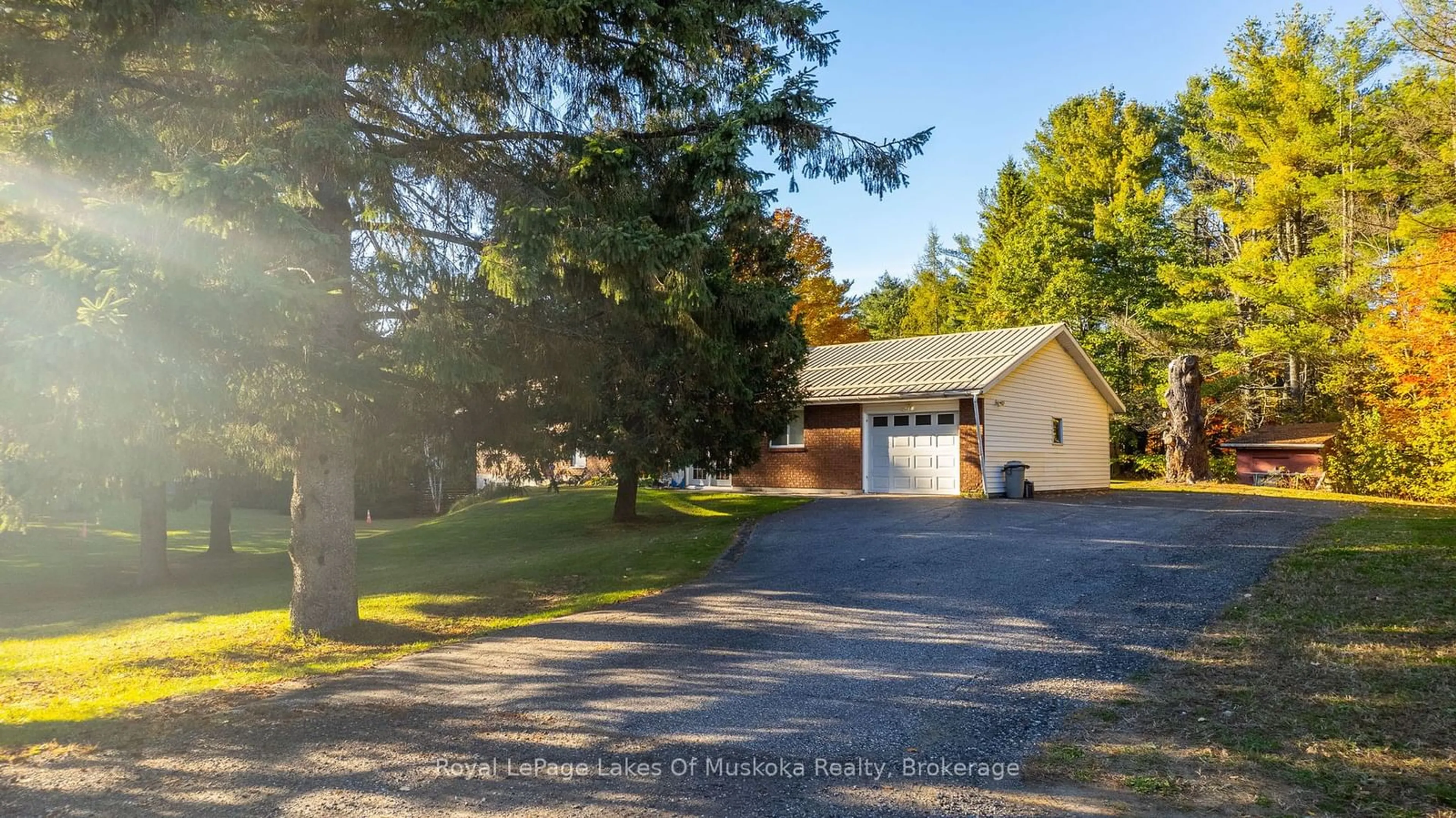 A pic from outside/outdoor area/front of a property/back of a property/a pic from drone, street for 1179 MUSKOKA ROAD 117, Bracebridge Ontario P1L 1W9