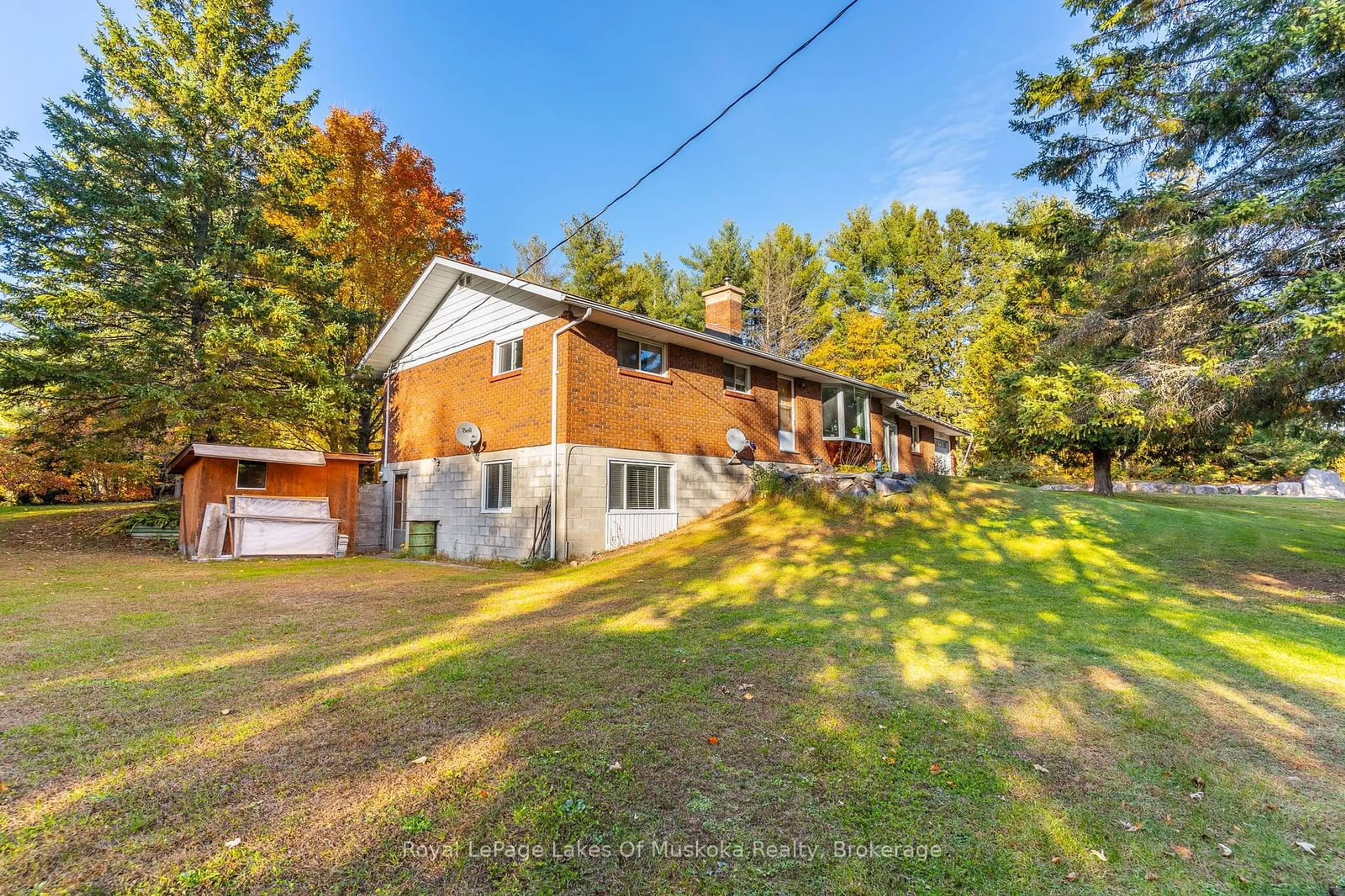 A pic from outside/outdoor area/front of a property/back of a property/a pic from drone, unknown for 1179 MUSKOKA ROAD 117, Bracebridge Ontario P1L 1W9