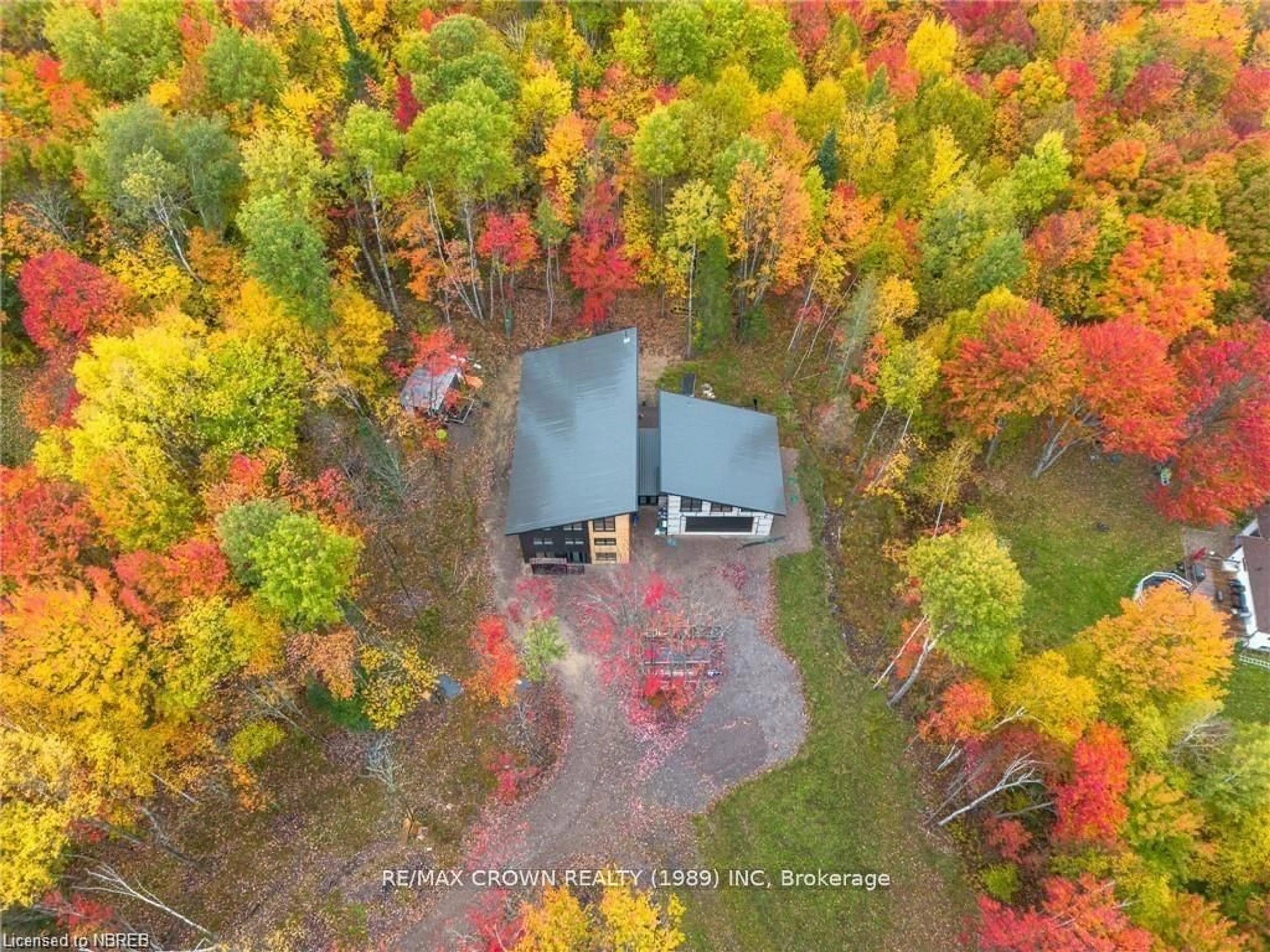 A pic from outside/outdoor area/front of a property/back of a property/a pic from drone, forest/trees view for 24 SUN VALLEY Way, Powassan Ontario P0H 1Z0