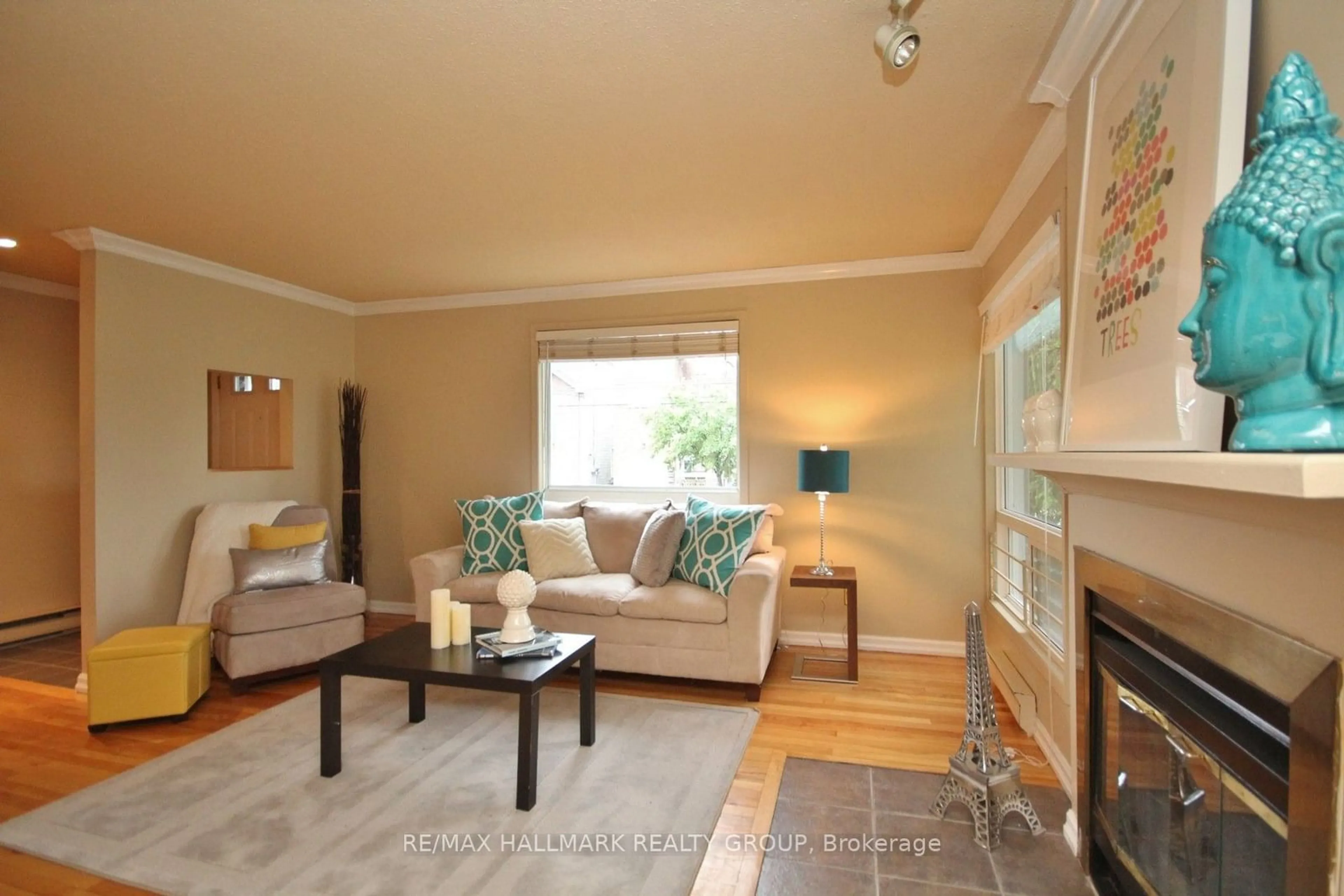 Living room with furniture, wood/laminate floor for 311 Presland Rd #A, Overbook - Castleheights and Area Ontario K1K 2B6