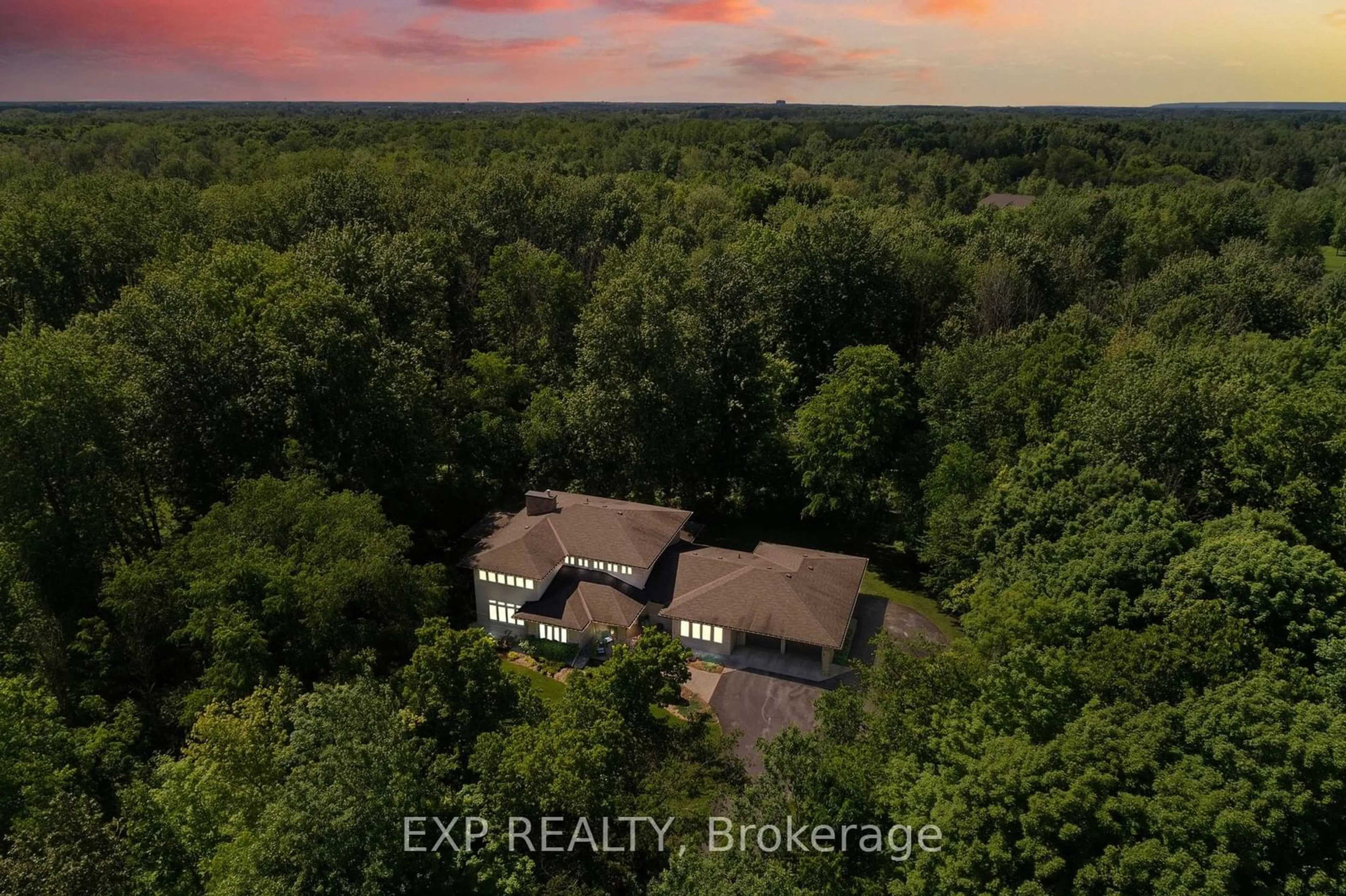 A pic from outside/outdoor area/front of a property/back of a property/a pic from drone, forest/trees view for 5759 Queenscourt Cres, Manotick - Kars - Rideau Twp and Area Ontario K4M 1K3