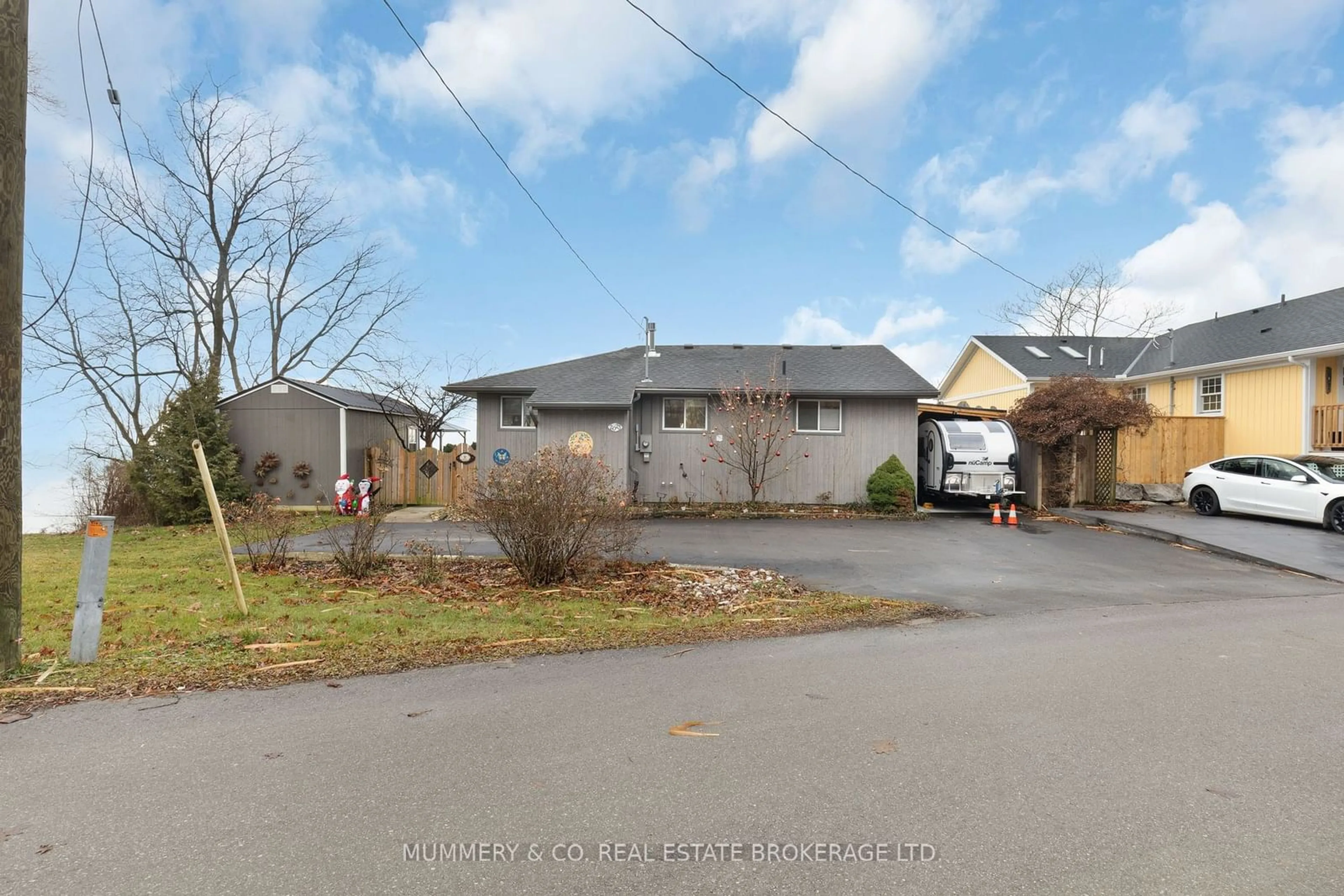 A pic from outside/outdoor area/front of a property/back of a property/a pic from drone, street for 2023 Maple Blvd, Norfolk Ontario N0A 1N2