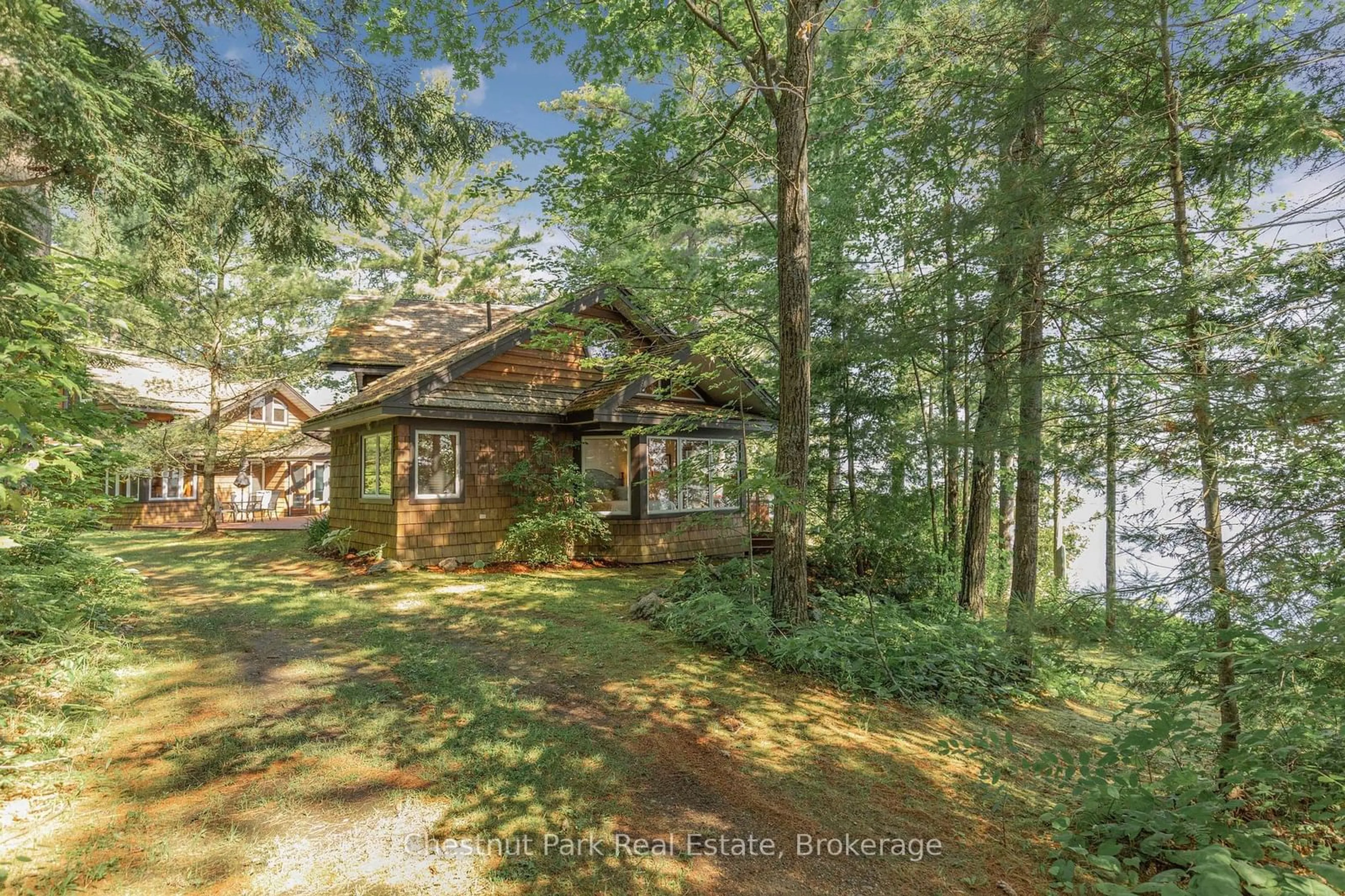 A pic from outside/outdoor area/front of a property/back of a property/a pic from drone, water/lake/river/ocean view for 1335 NARROWS Rd, Gravenhurst Ontario P1P 1R2