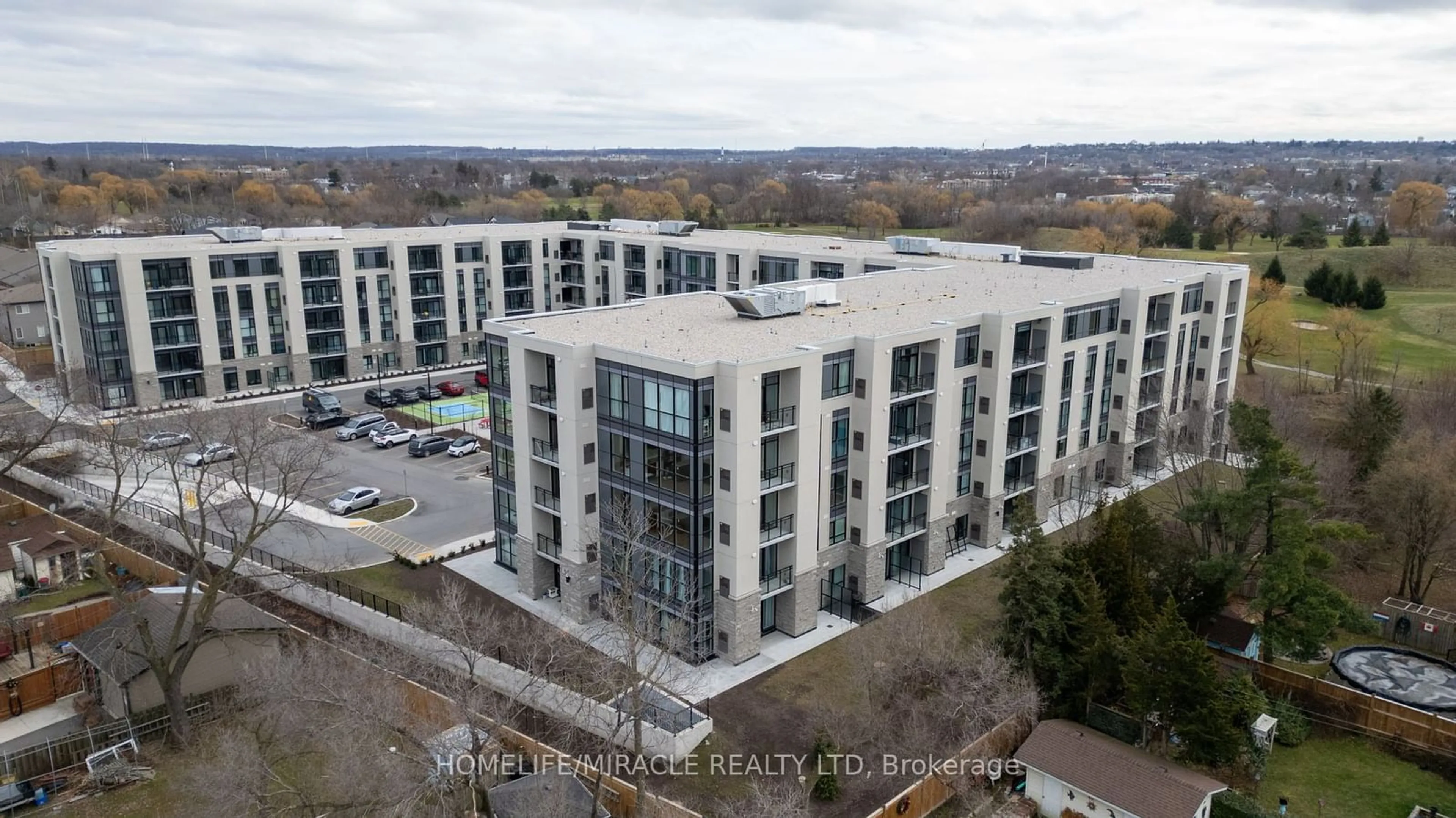 A pic from outside/outdoor area/front of a property/back of a property/a pic from drone, city buildings view from balcony for 50 Herrick Ave #LP40, St. Catharines Ontario L2P 2T9