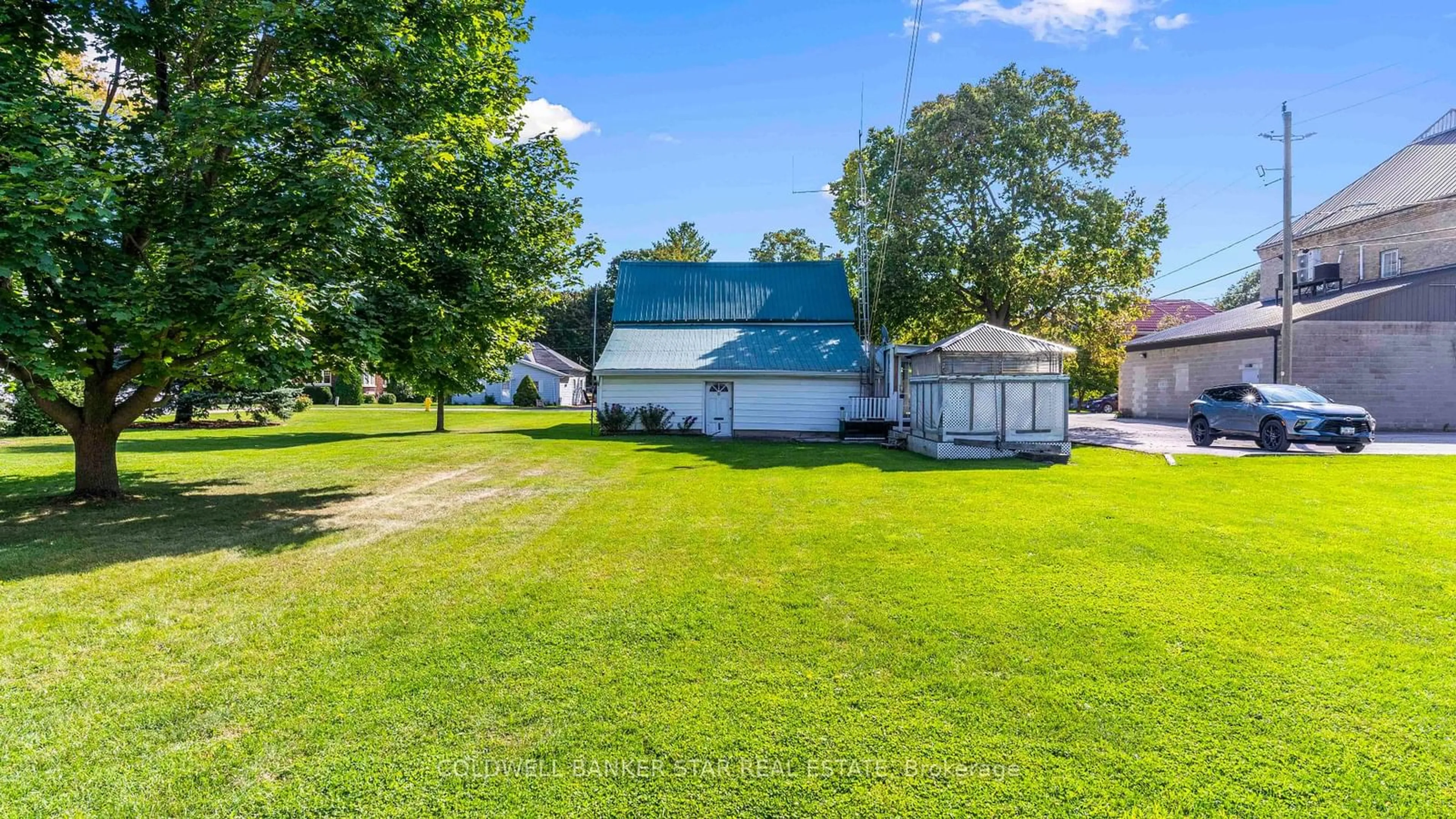 A pic from outside/outdoor area/front of a property/back of a property/a pic from drone, water/lake/river/ocean view for 117 Jameson St, North Middlesex Ontario N0M 1A0