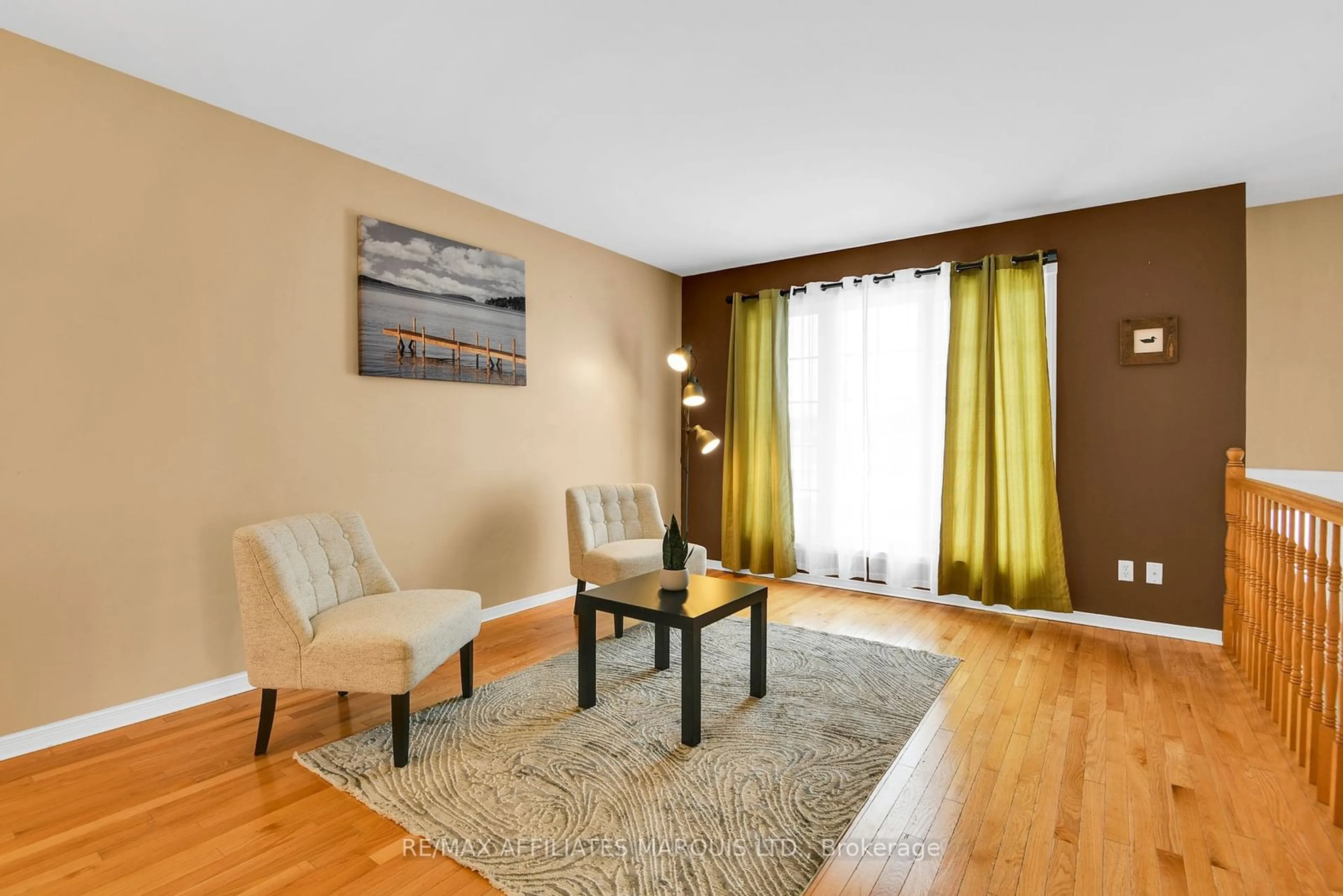 Living room with furniture, wood/laminate floor for 2024 Concorde Ave, Cornwall Ontario K6H 6R4