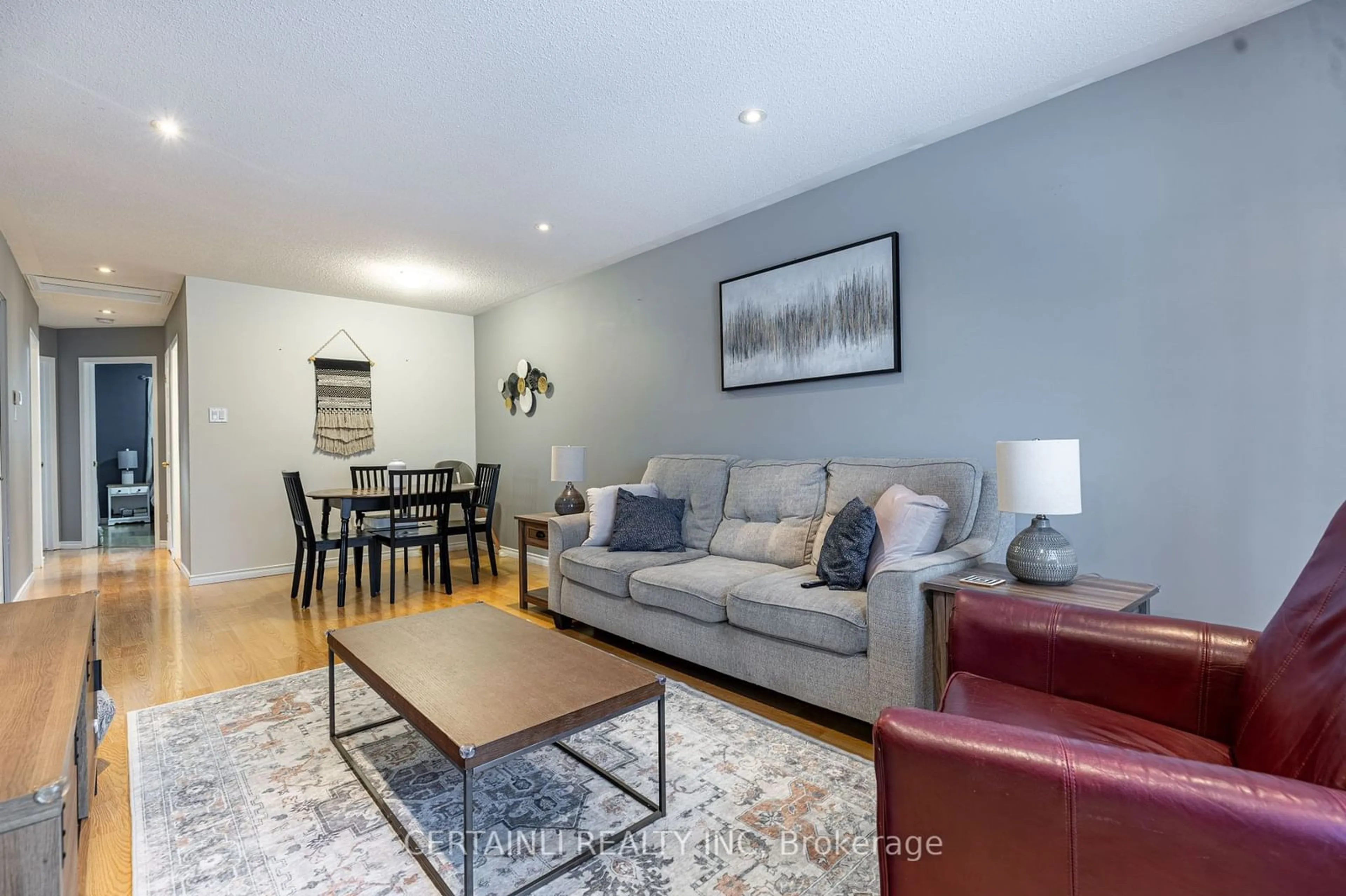 Living room with furniture, wood/laminate floor for 243 Wildgoose Rd, London Ontario N5W 6E2