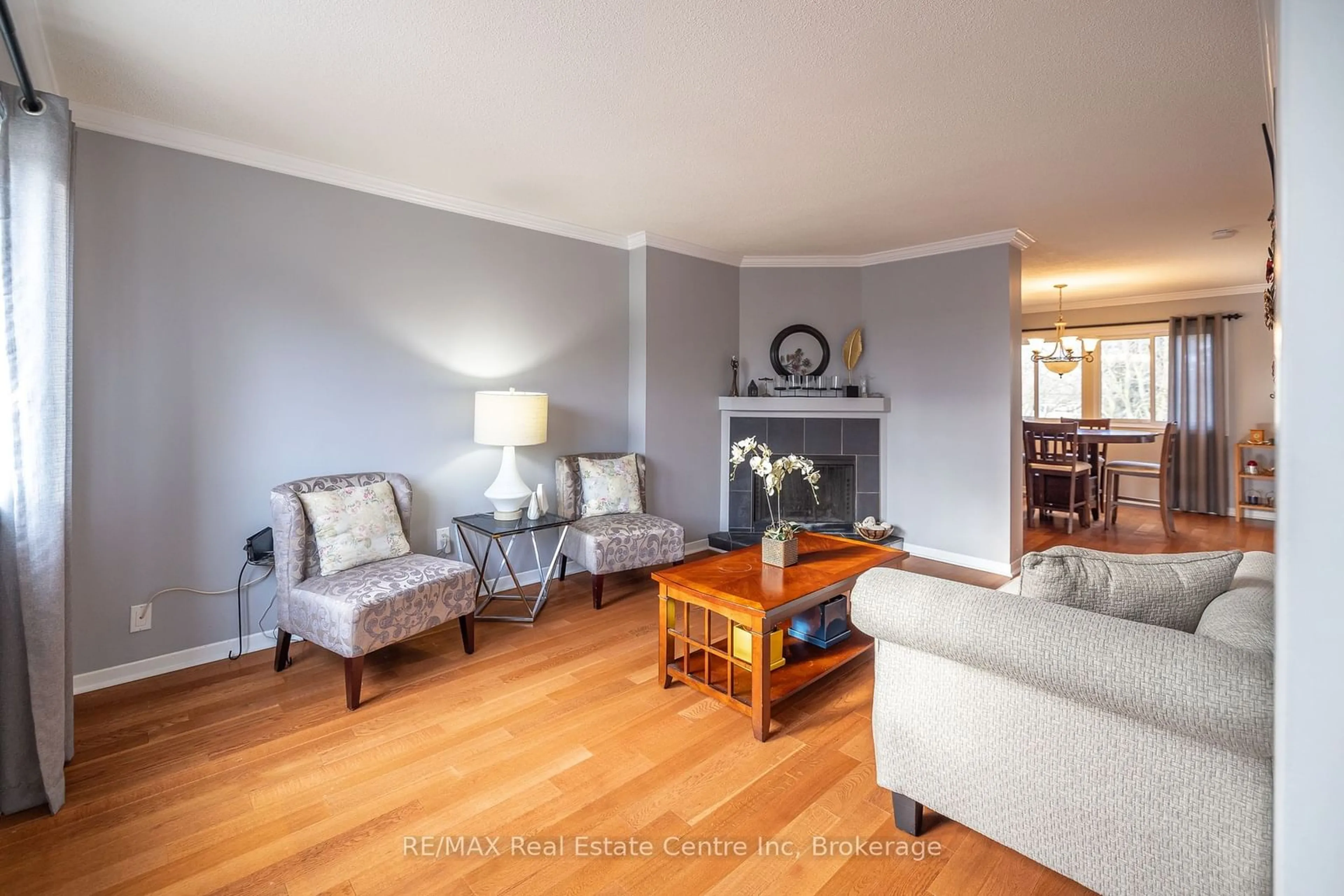 Living room with furniture, wood/laminate floor for 295 Water St #15, Guelph Ontario N1G 2X5