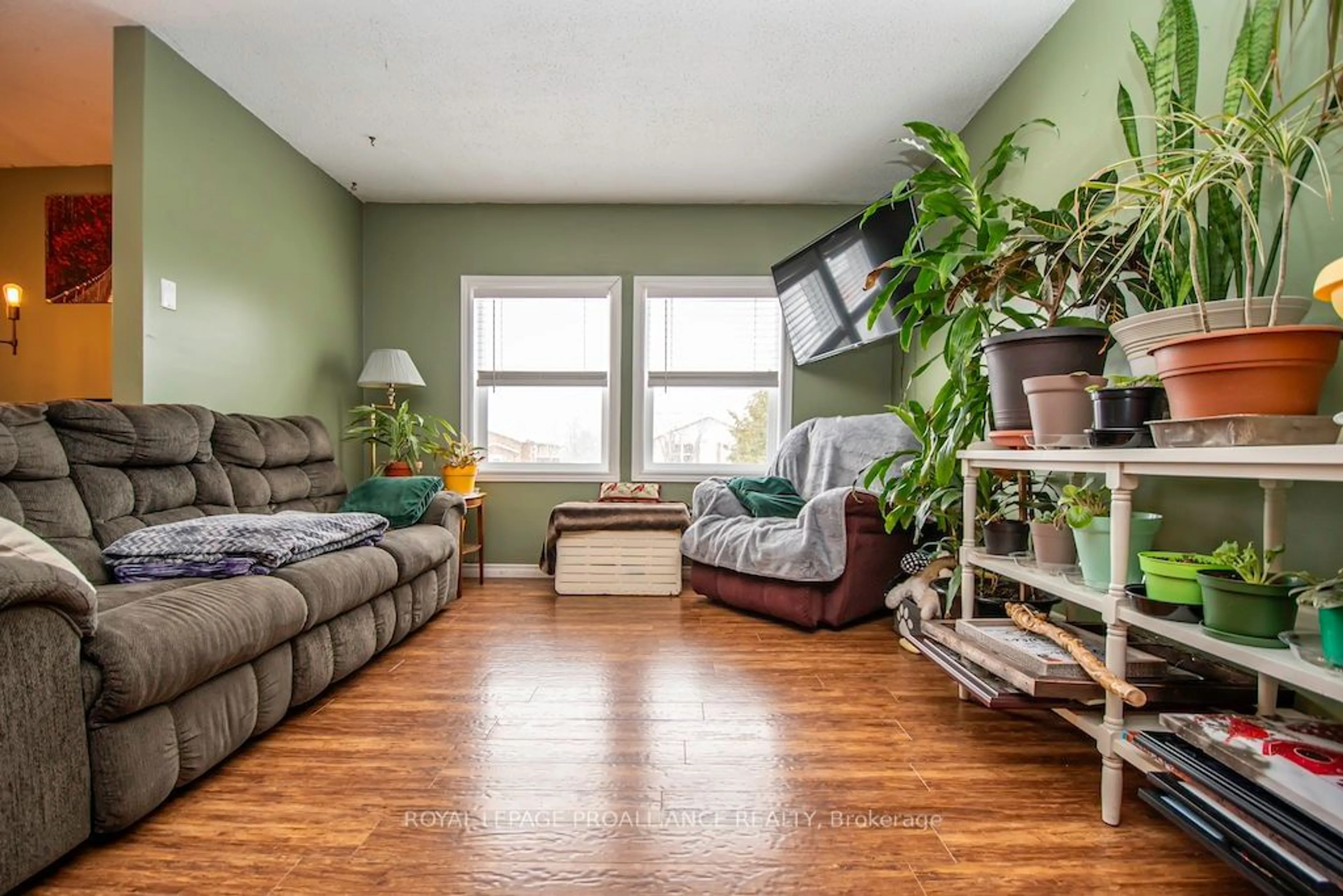 Living room with furniture, wood/laminate floor for 8 Century Blvd, Cavan Monaghan Ontario L0A 1G0