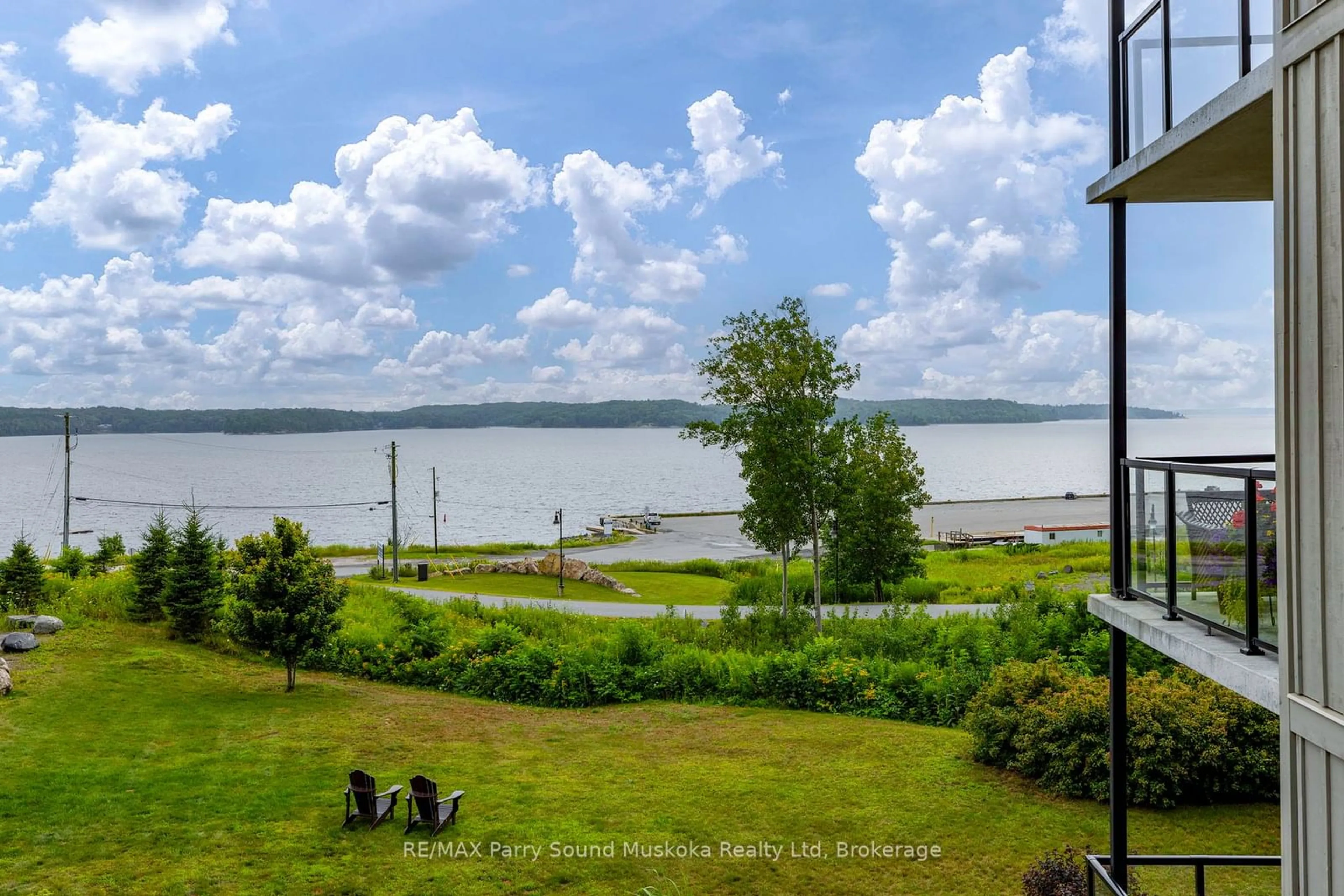 A pic from outside/outdoor area/front of a property/back of a property/a pic from drone, water/lake/river/ocean view for 11C Salt Dock Rd #201, Parry Sound Ontario P2A 3B6