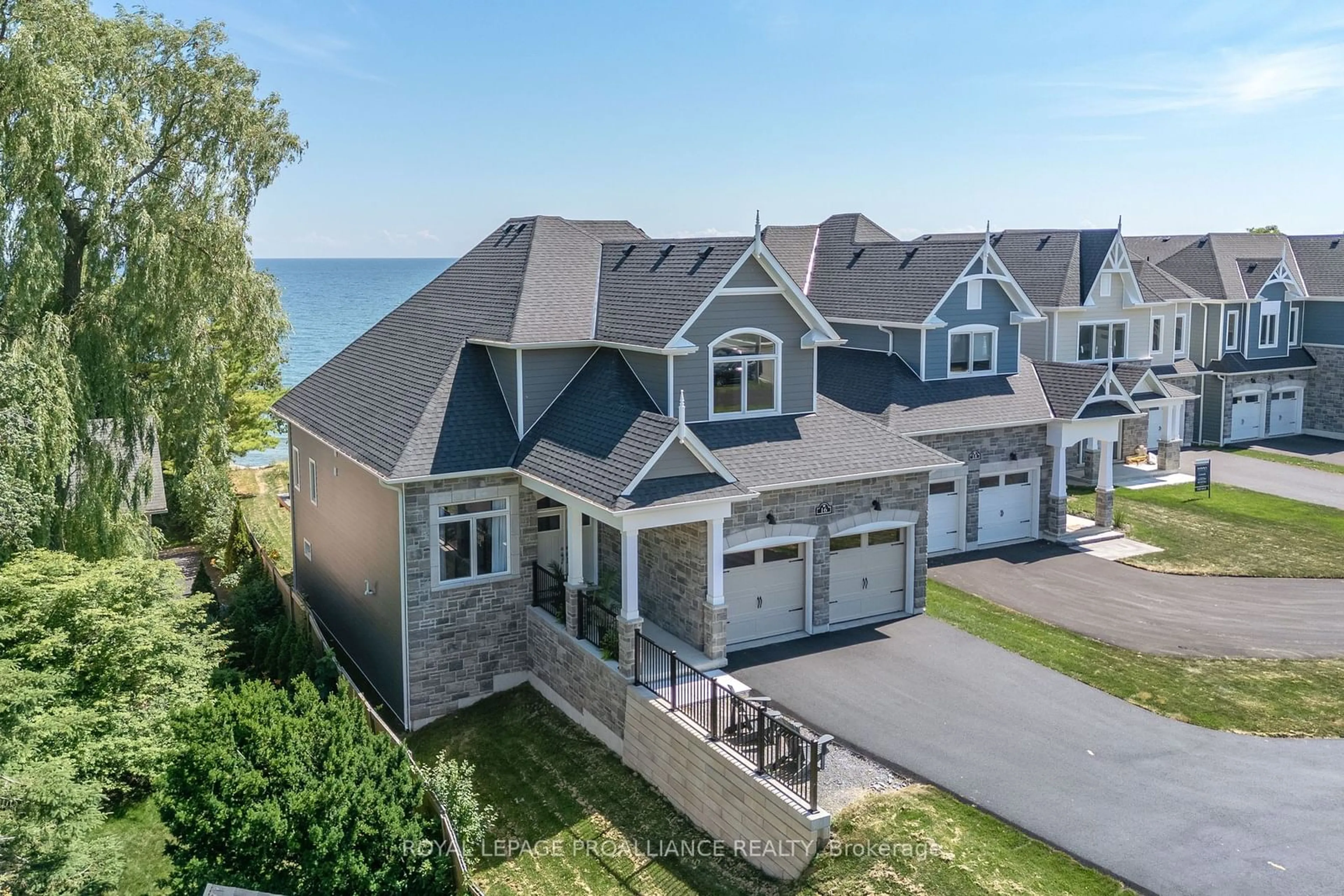 A pic from outside/outdoor area/front of a property/back of a property/a pic from drone, water/lake/river/ocean view for 16 Twelve Trees Crt, Prince Edward County Ontario K0K 3L0