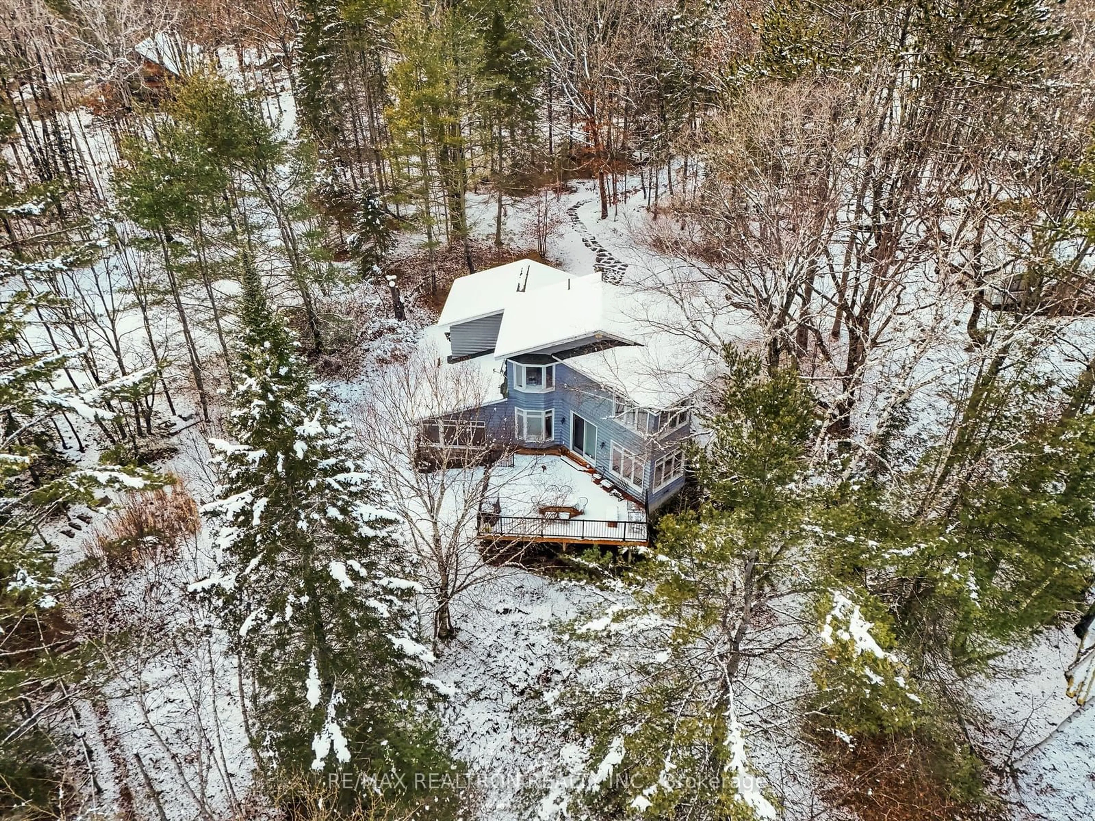 A pic from outside/outdoor area/front of a property/back of a property/a pic from drone, forest/trees view for 23 Rocky Dr, Huntsville Ontario P1H 2J2