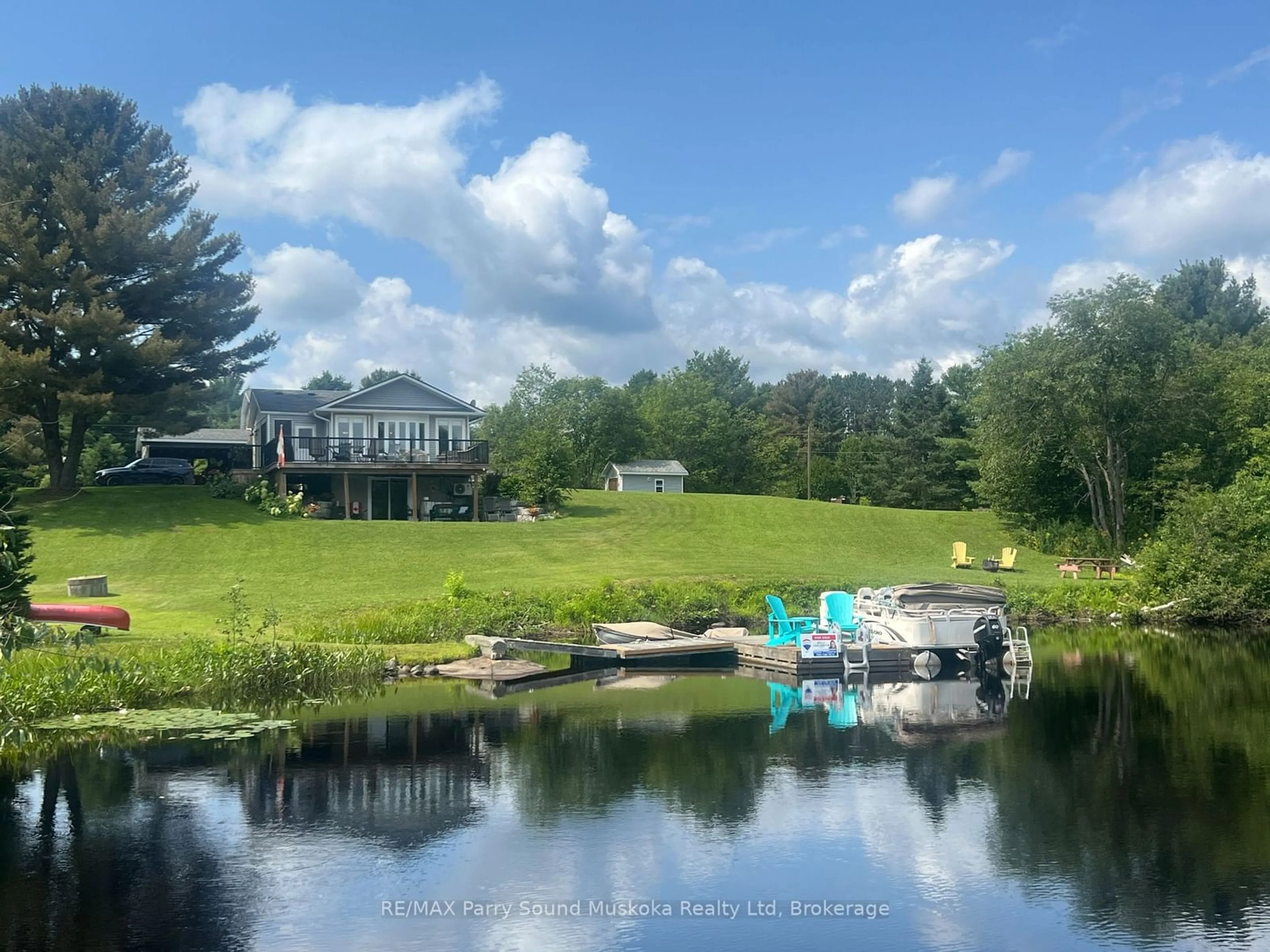 A pic from outside/outdoor area/front of a property/back of a property/a pic from drone, water/lake/river/ocean view for 126 Broadbent Rd, McKellar Ontario P2A 0B5