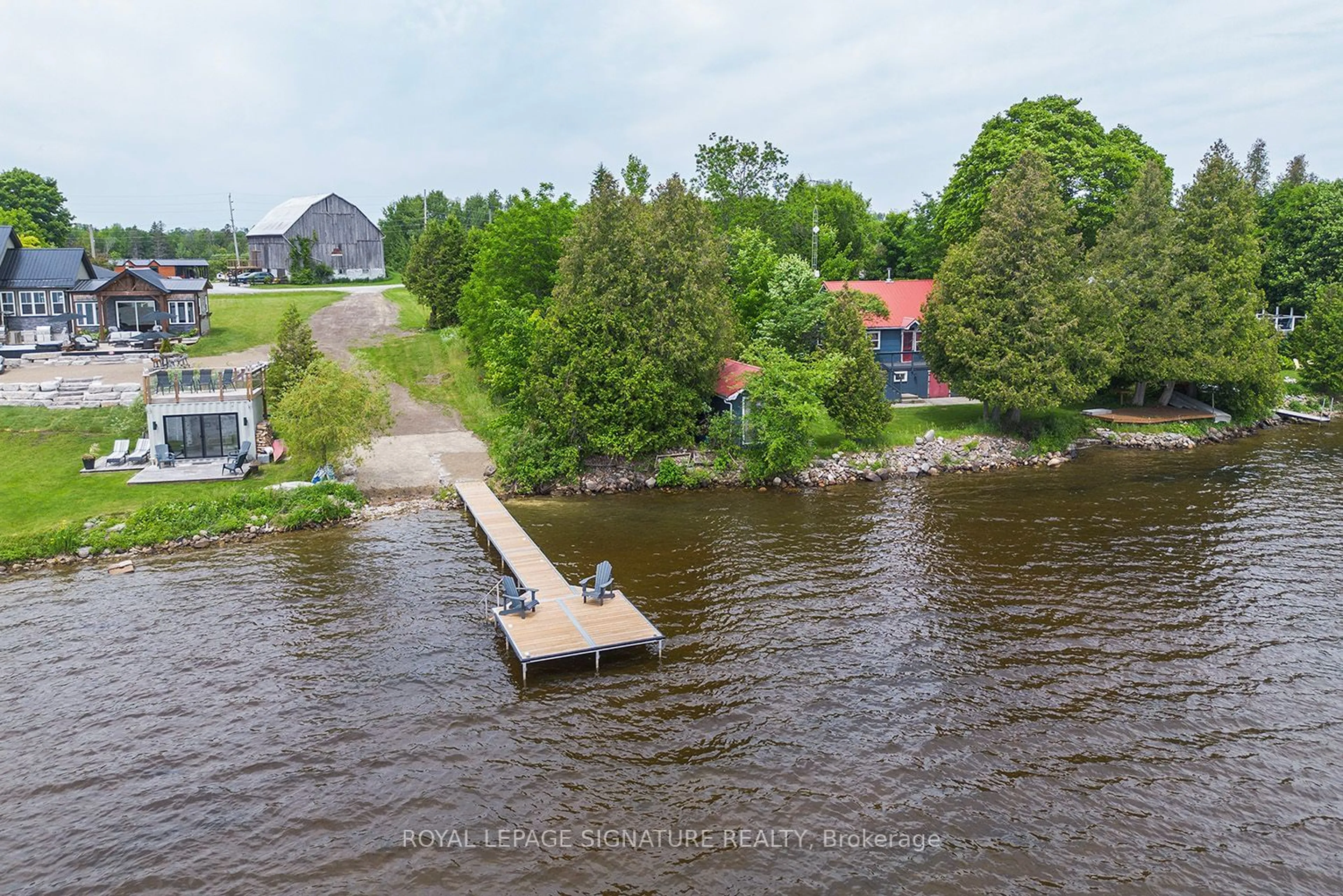 A pic from outside/outdoor area/front of a property/back of a property/a pic from drone, water/lake/river/ocean view for 31 Blue Bay Lane, Kawartha Lakes Ontario K0M 1N0