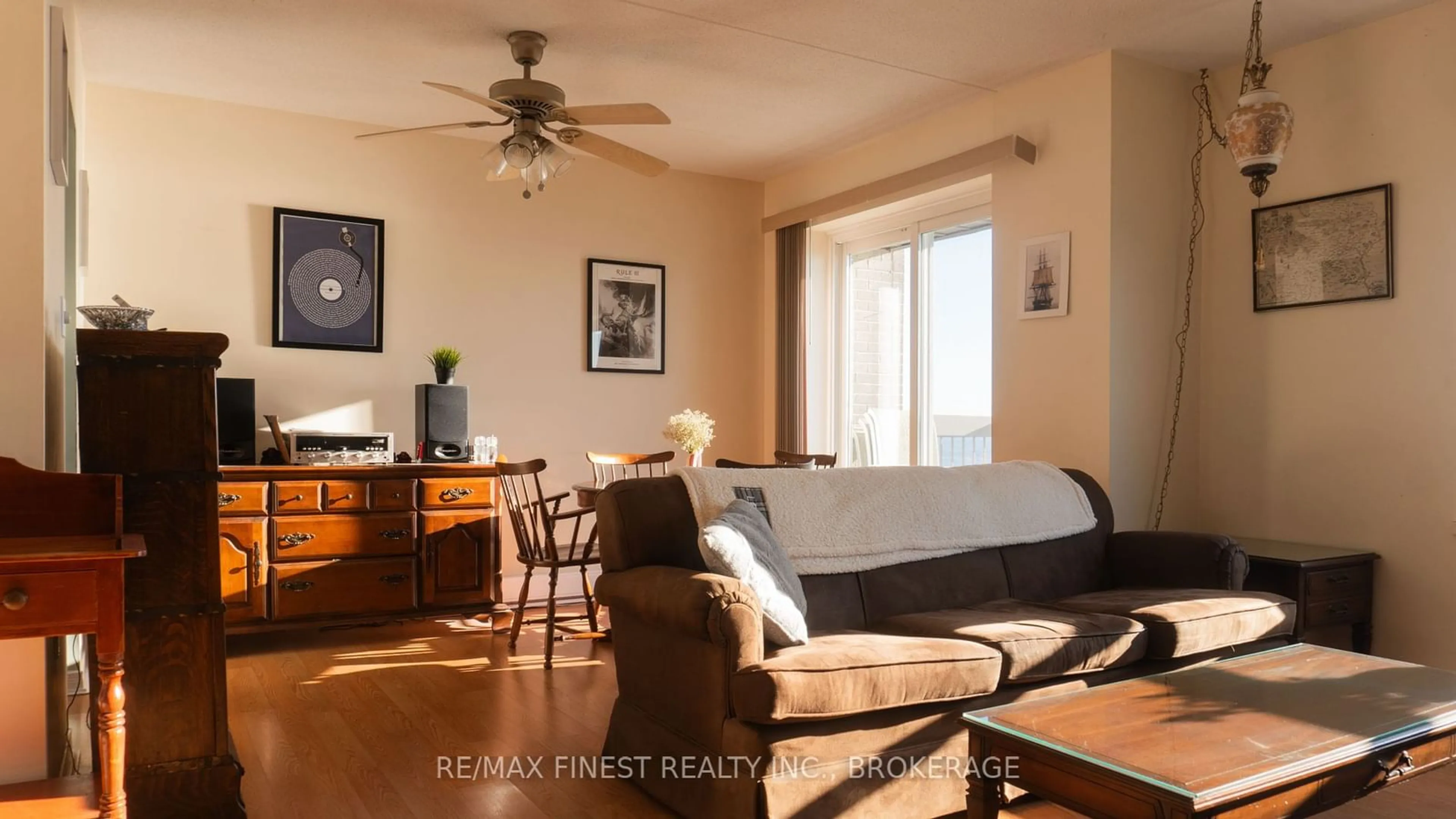 Living room with furniture, wood/laminate floor for 235 Water St #607, Prescott Ontario K0E 1T0