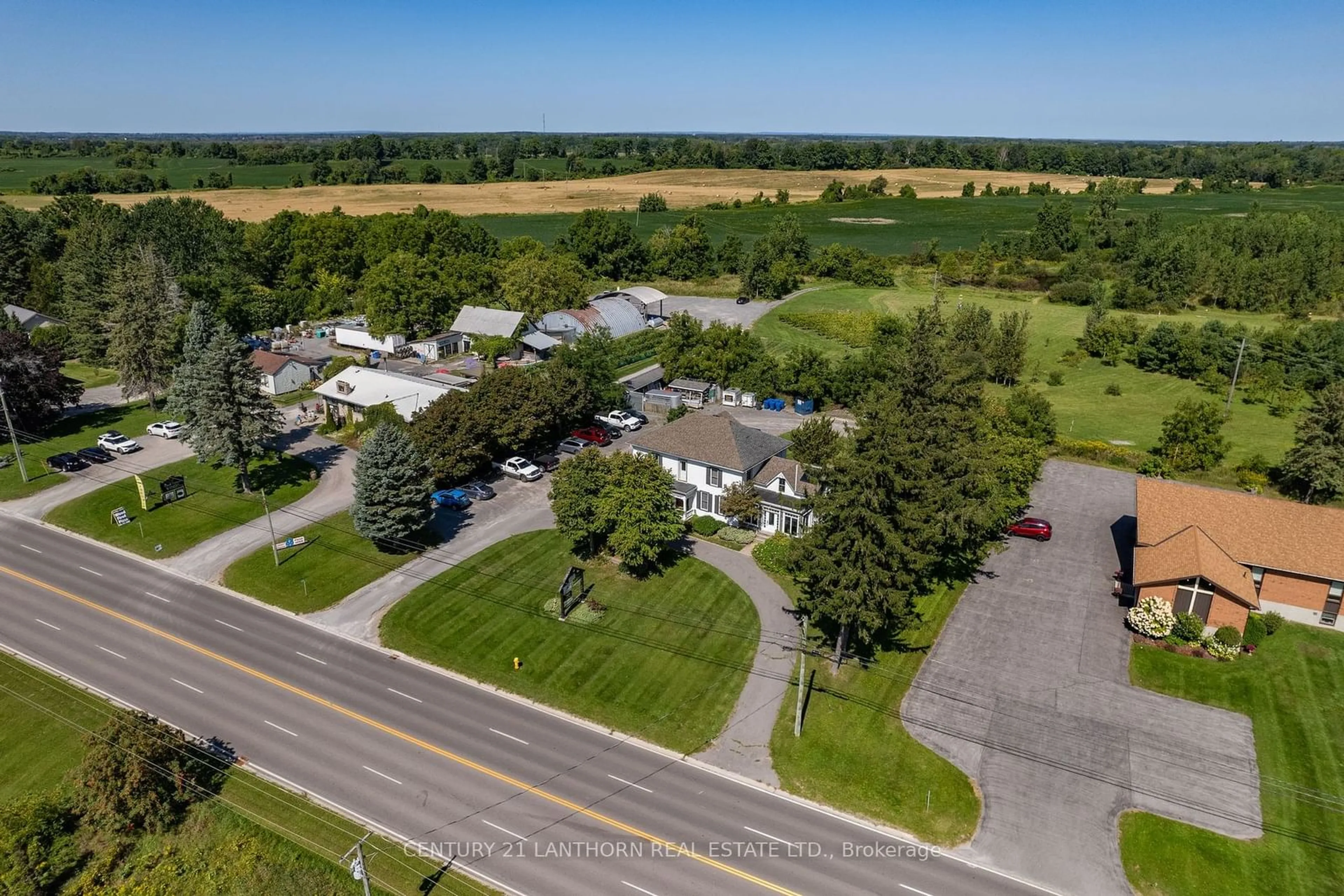 A pic from outside/outdoor area/front of a property/back of a property/a pic from drone, street for 13360 Loyalist Pkwy, Prince Edward County Ontario K0K 2T0