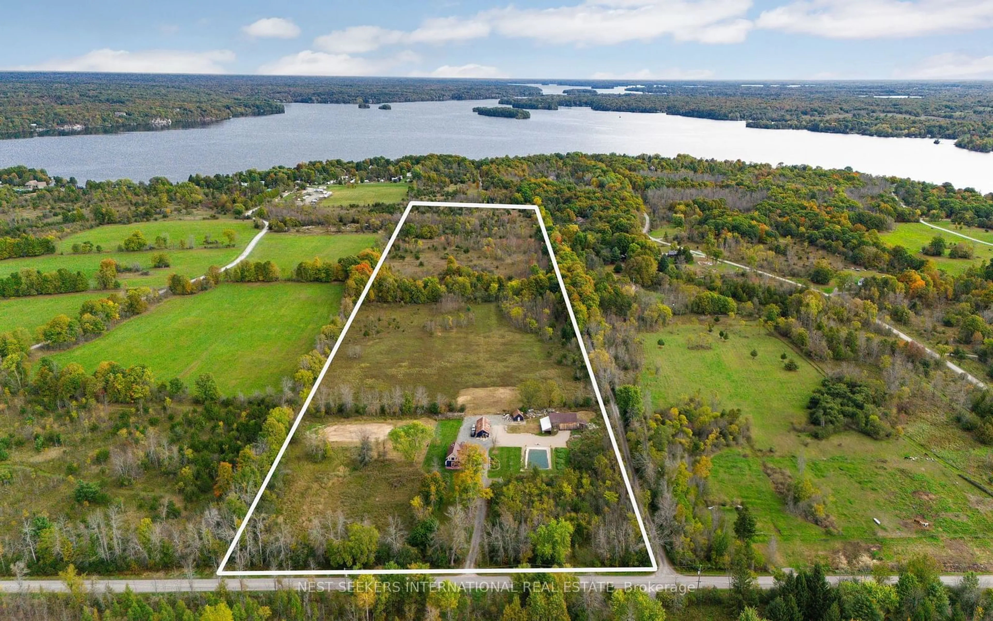 A pic from outside/outdoor area/front of a property/back of a property/a pic from drone, water/lake/river/ocean view for 145 Sunnyside Rd, Westport Ontario K0G 1X0