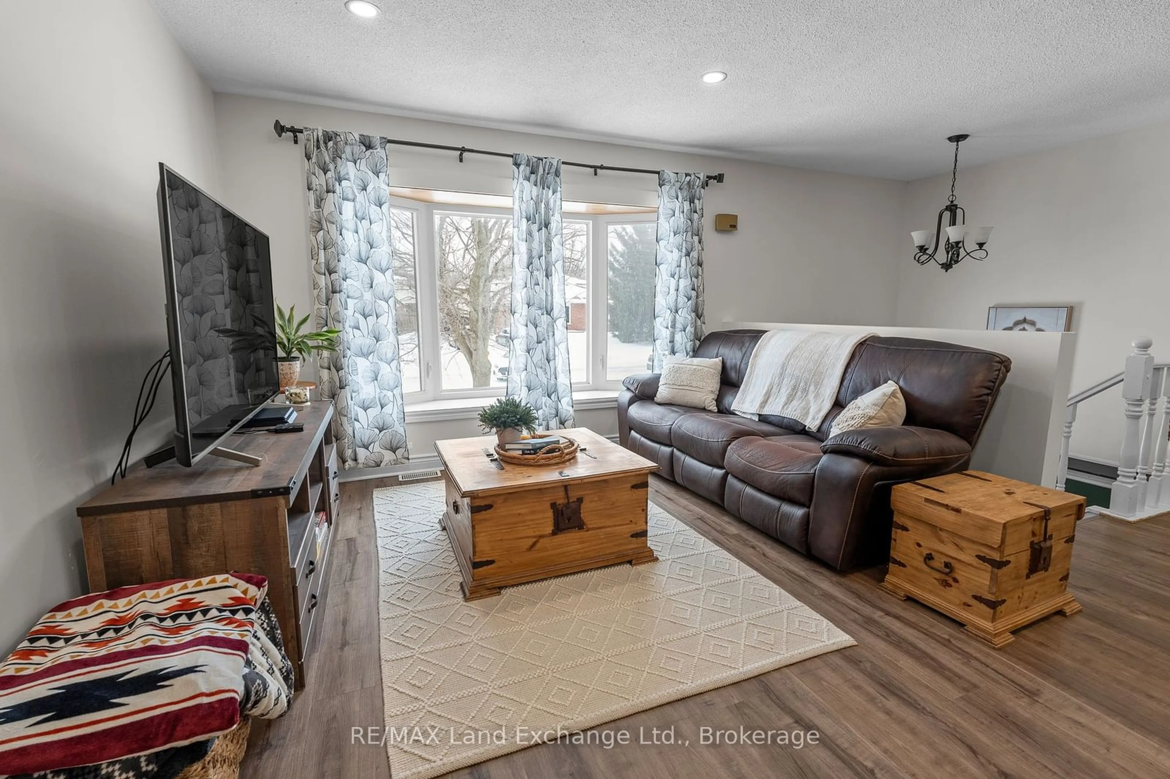 Living room with furniture, wood/laminate floor for 364 Bricker St, Saugeen Shores Ontario N0H 2C1