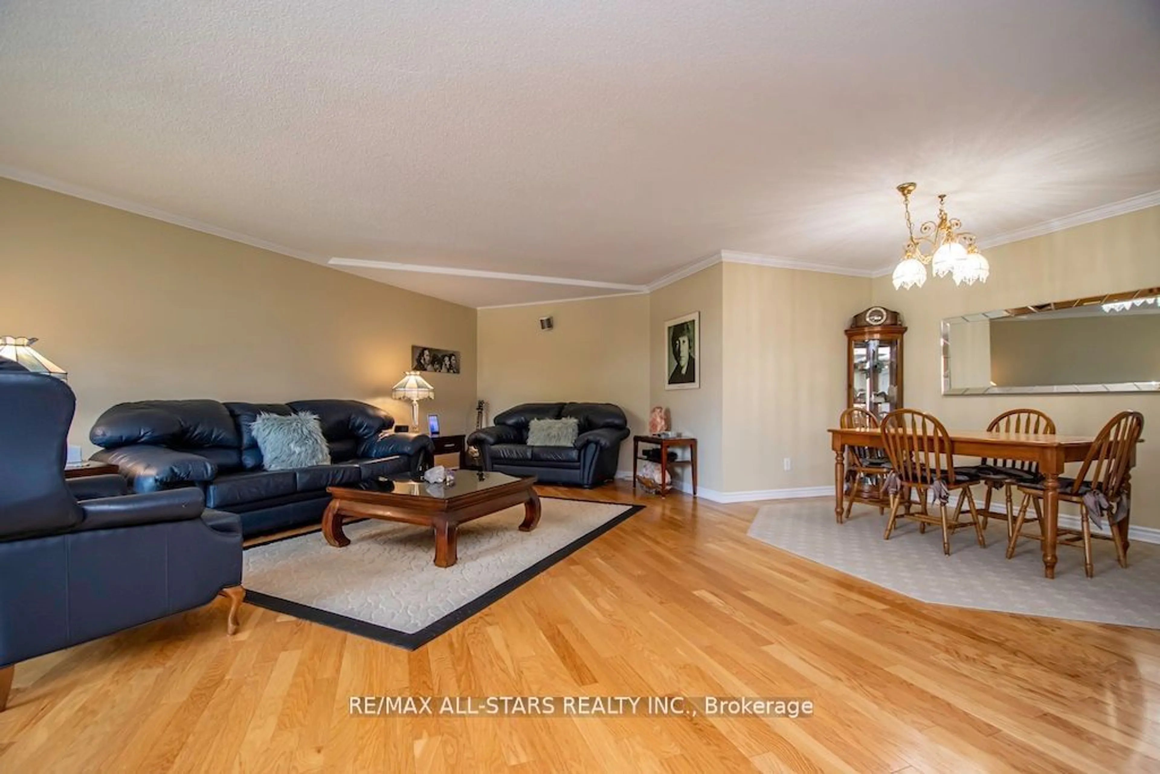 Living room with furniture, wood/laminate floor for 51 Rivermill Blvd #305, Kawartha Lakes Ontario K9V 6E8