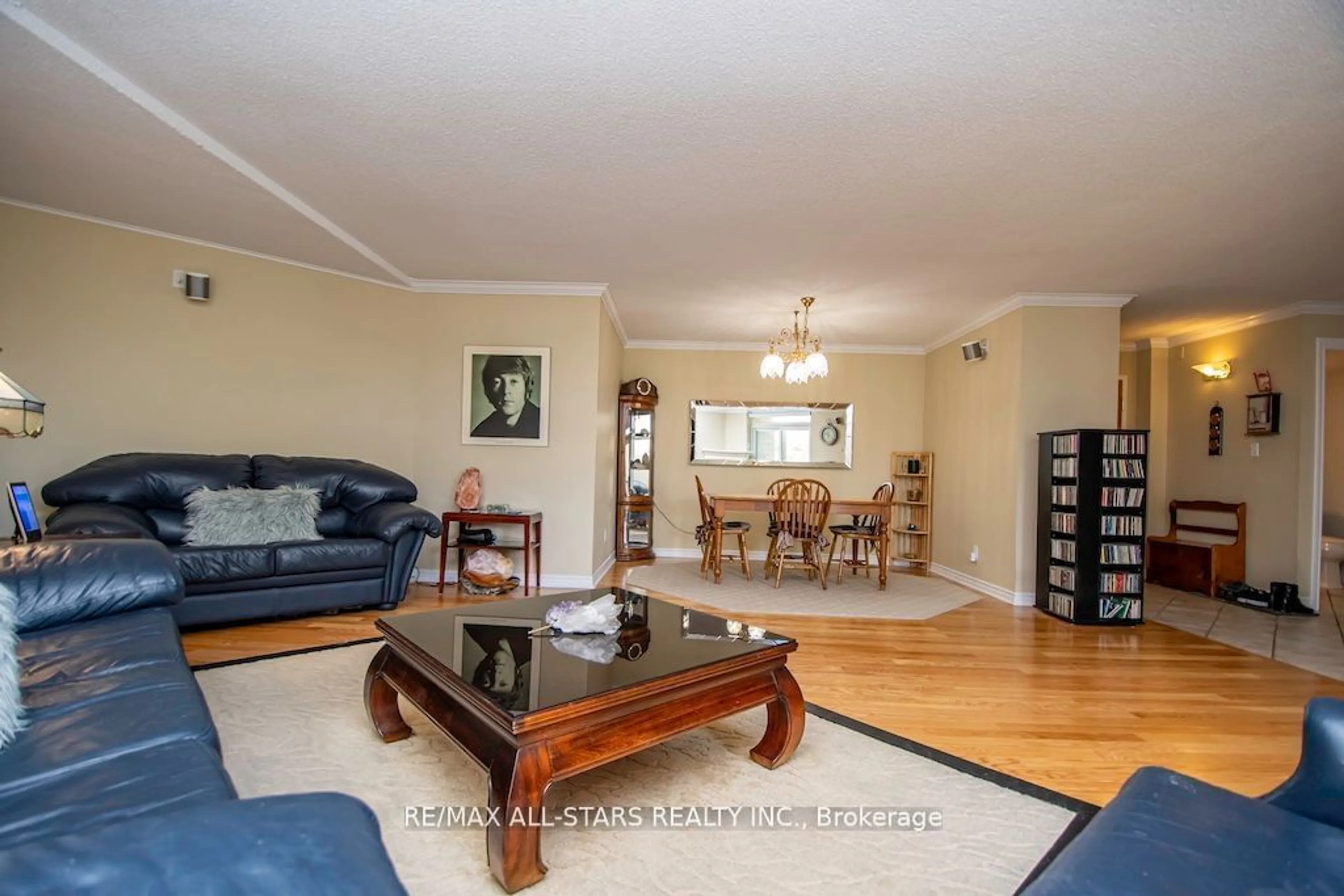 Living room with furniture, wood/laminate floor for 51 Rivermill Blvd #305, Kawartha Lakes Ontario K9V 6E8